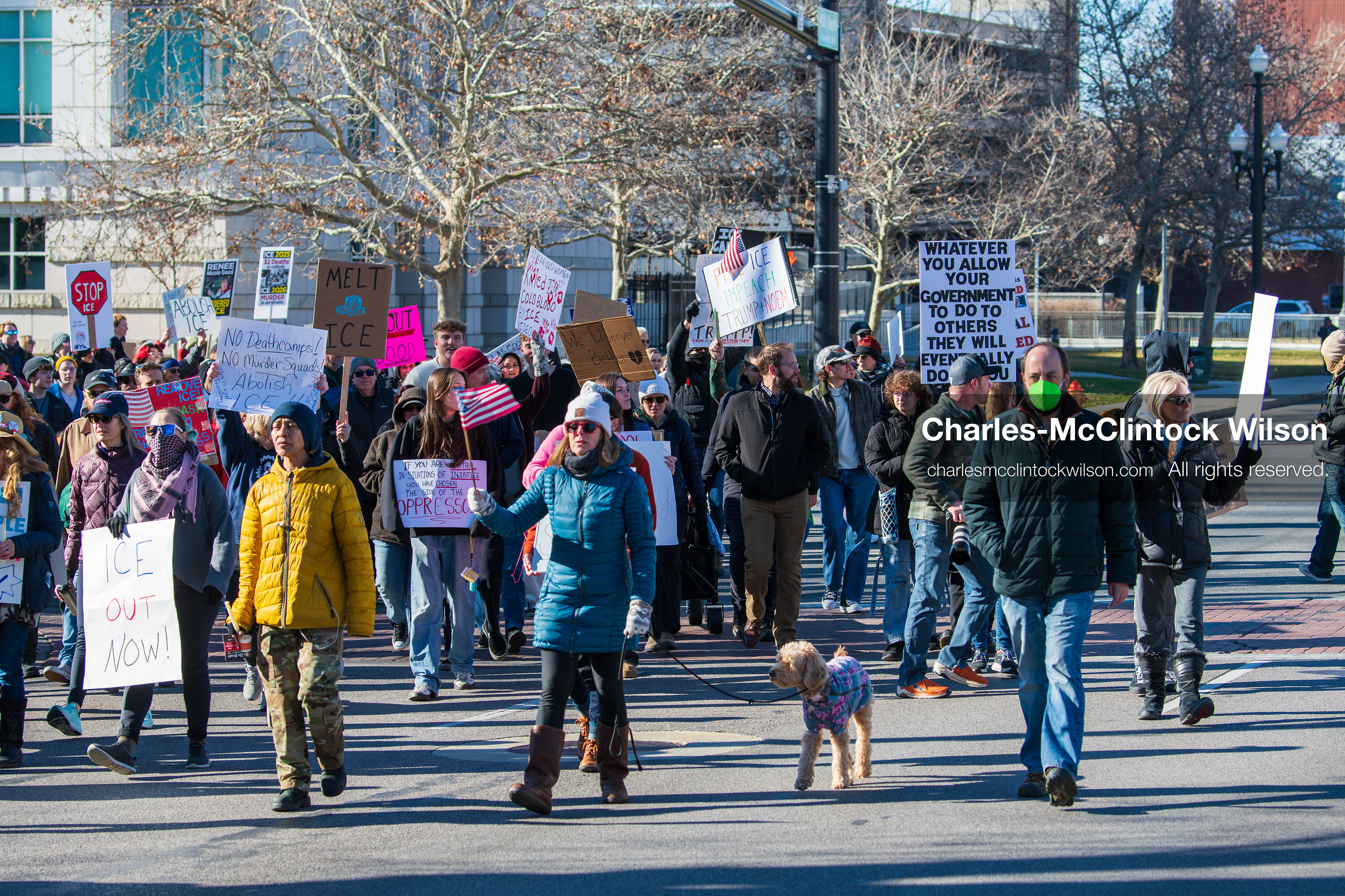Salt Lake City, Utah, January 10, 2026: A group of demonstrators marches through downtown Salt Lake City during the ICE Out for Good protest, which began at Washington Square Park, with participants carrying signs and personal items as they walk together. (Credit Image: © Charles‑McClintock Wilson/ZUMA Press Wire)