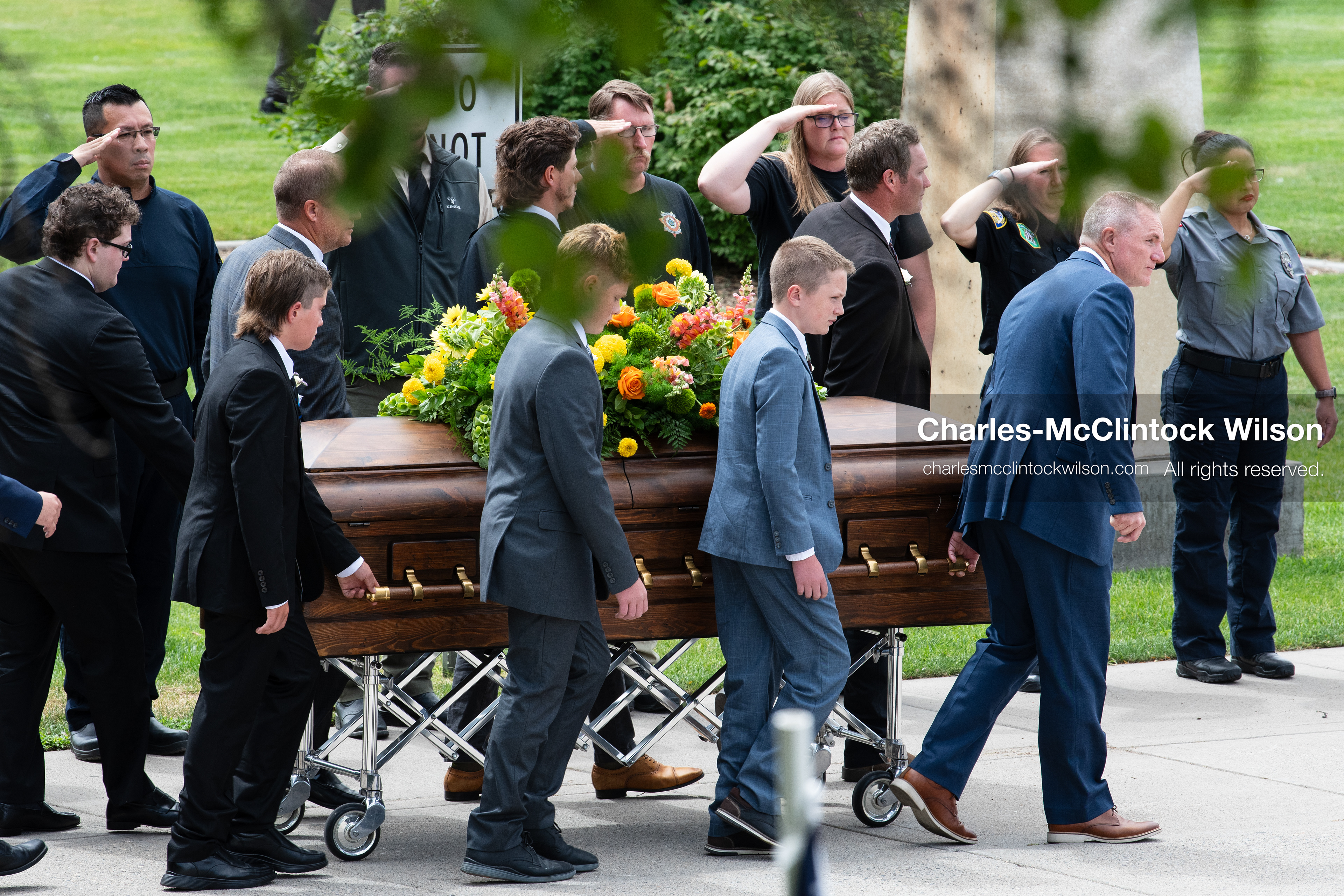 Pallbearers and family members escort the casket of a Long family member outside the UCCU Center at Utah Valley University in Orem, Utah, on Wednesday, July 29, 2026. More than 300 people came to the public memorial ceremony to honor Provo Fire Captain Spencer Long, his wife Katrina, and three of their sons, who died after a flash flood hit their campsite near the Sunglow Campground in Wayne County. (Photo by Charles-McClintock Wilson/Sipa USA)