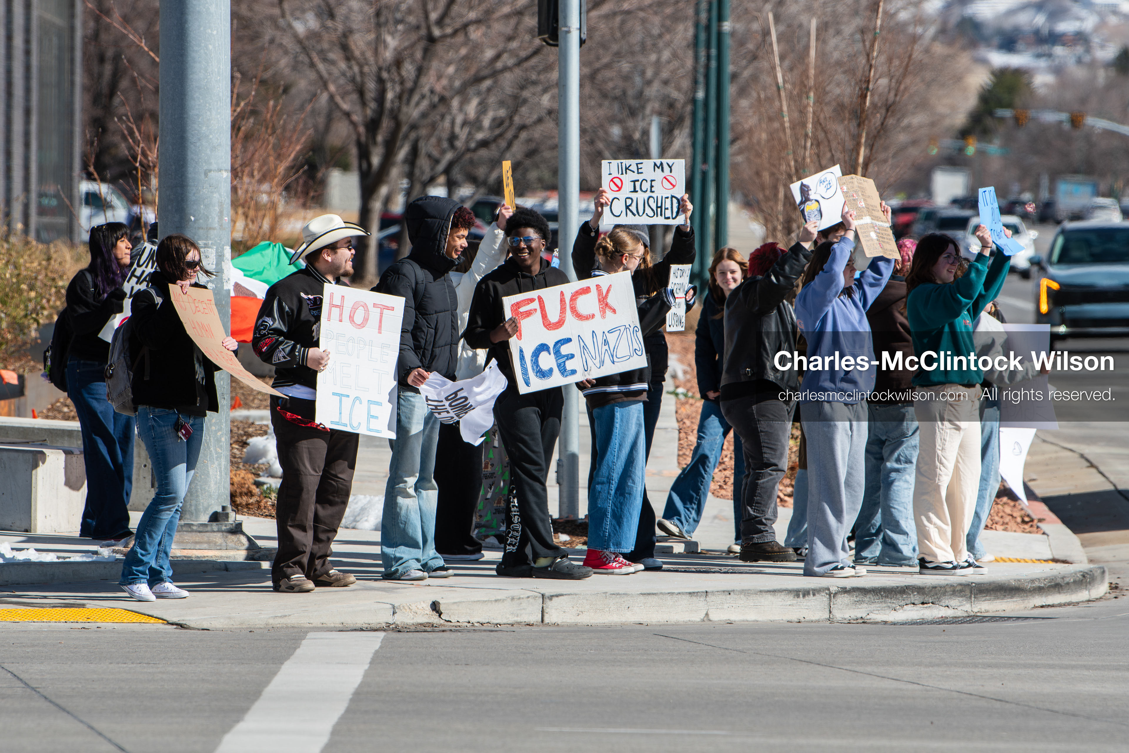 February 20, 2026, Orem, Utah, USA: High school students gather along State Street in front of Orem City Hall during a student led protest against ICE and federal immigration enforcement. Demonstrators hold signs as they stand near the roadway while traffic continues through the area. (Credit Image: © Charles McClintock Wilson/ZUMA Press Wire)