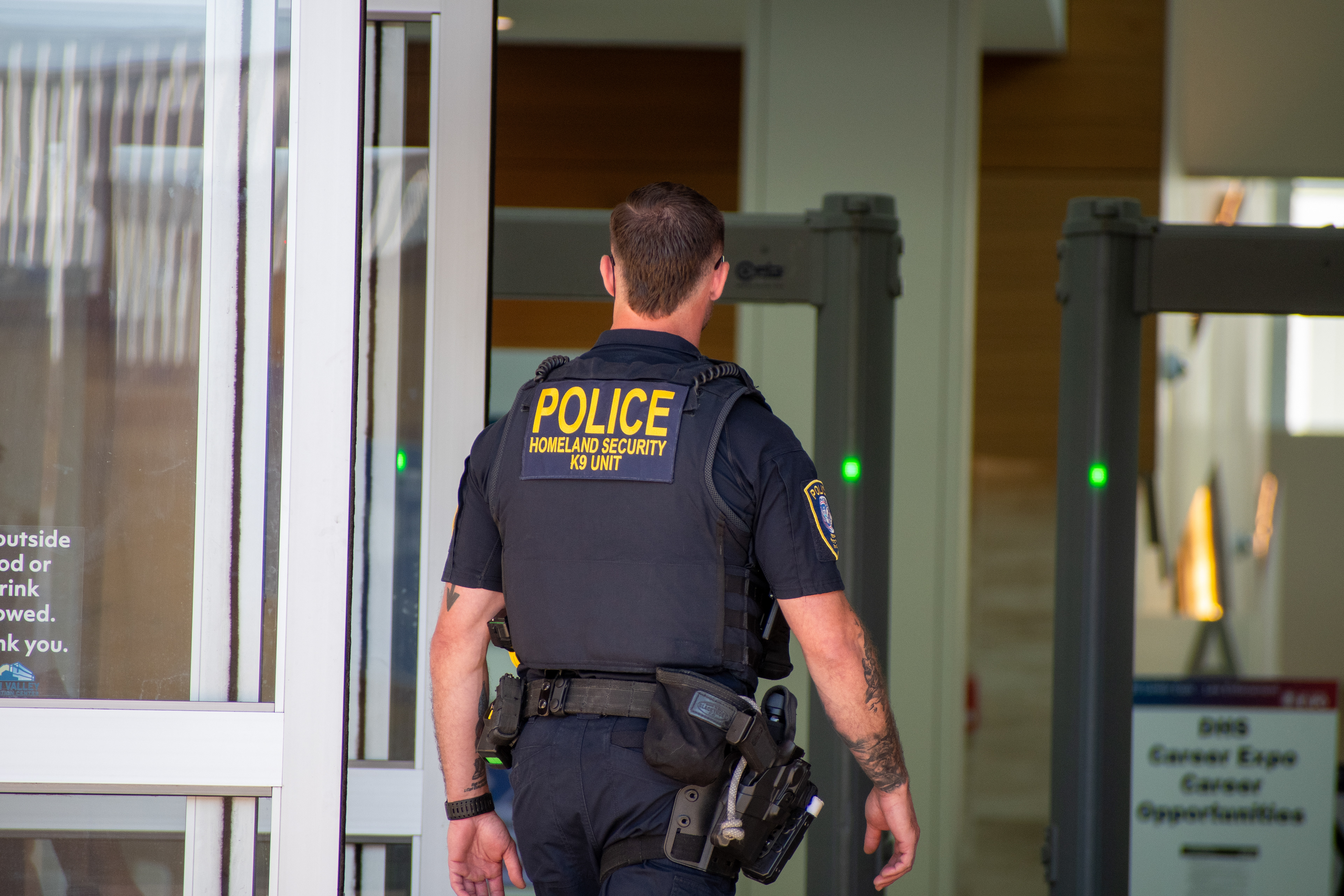 September 15, 2025 – Provo, Utah, United States: A Homeland Security police officer enters the Utah Valley Convention Center through a security checkpoint during a Department of Homeland Security career expo focused on recruiting law enforcement and security personnel. Photograph by Charles‑McClintock Wilson / ZUMA Press Wire