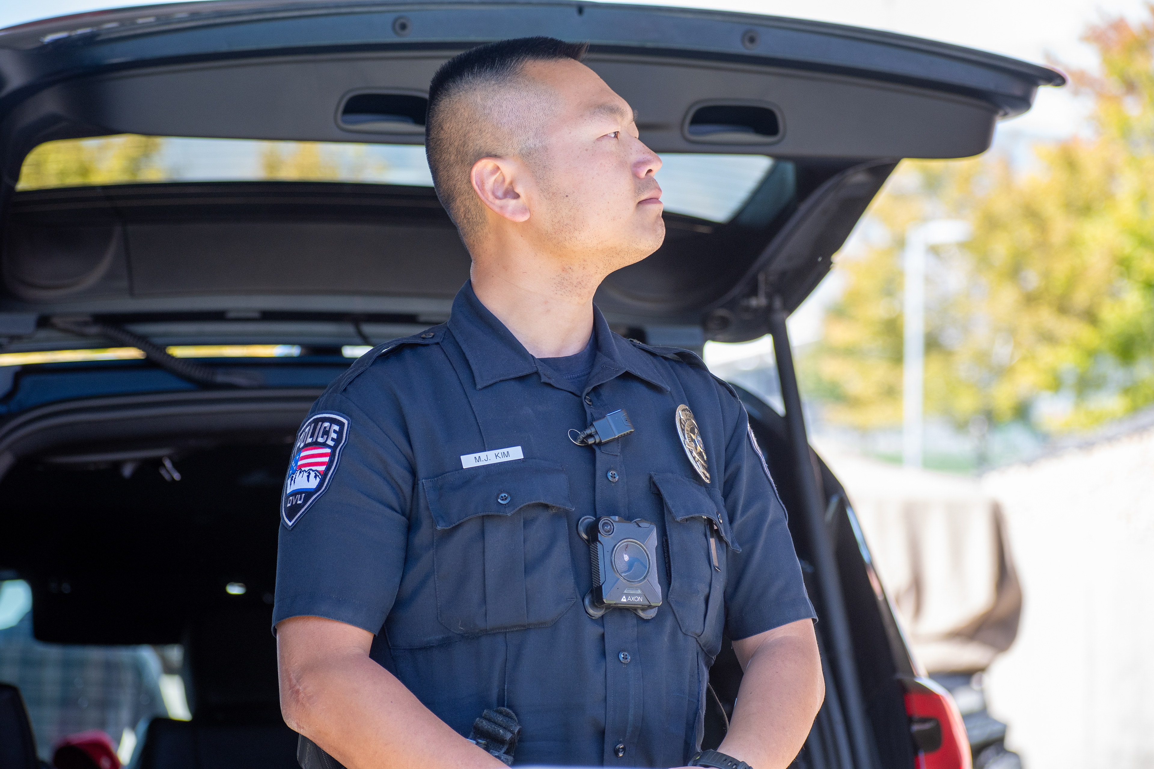 September 10, 2025 – Orem, Utah, United States: A Utah Valley University police officer stands beside a patrol vehicle while securing the campus ahead of a scheduled public event featuring conservative activist Charlie Kirk. Photograph by Charles‑McClintock Wilson / ZUMA Press Wire
