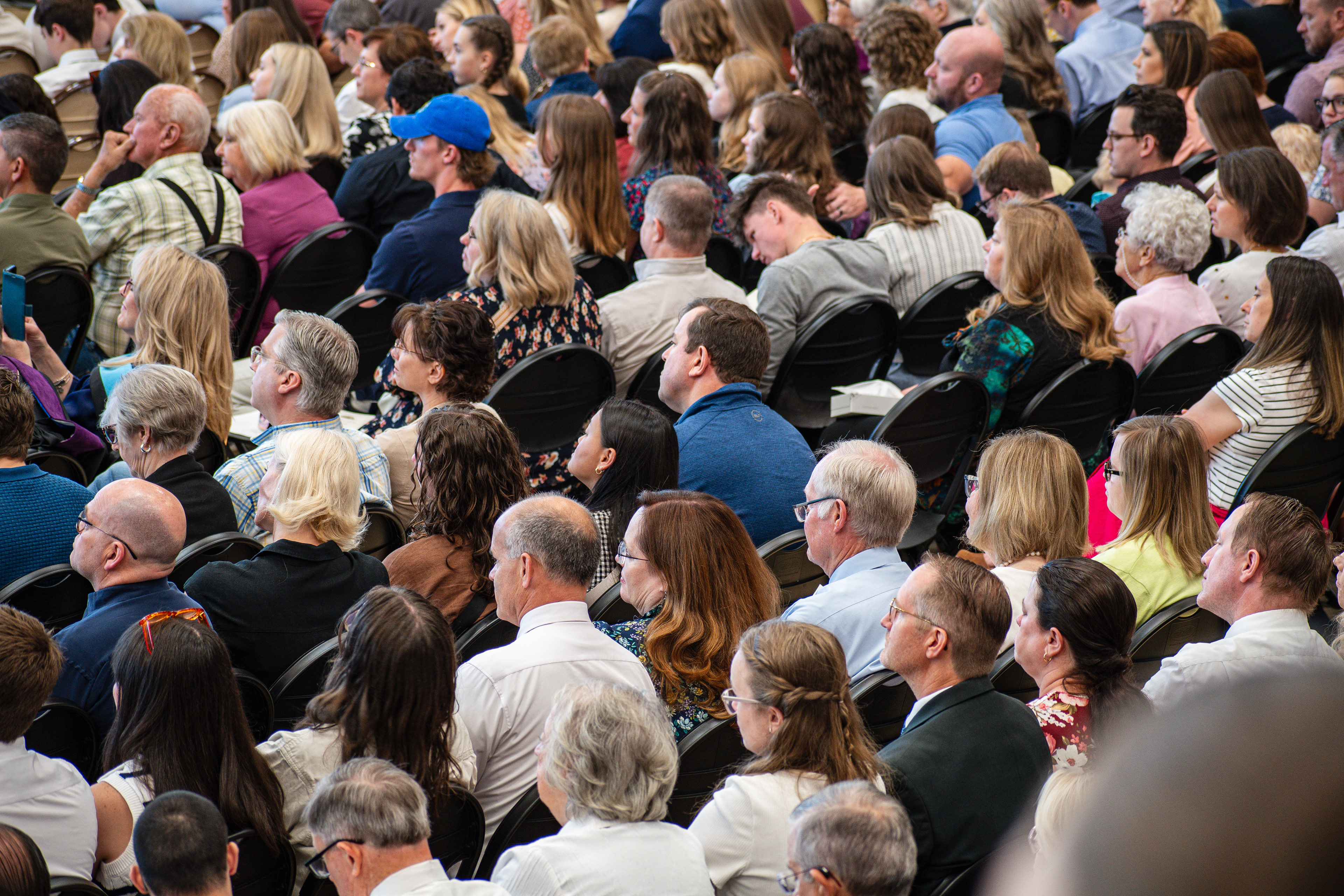 AMERICAN FORK, UT, USA – MAY 24, 2025: Attendees gather at a school in American Fork, Utah, to celebrate and witness the graduation ceremony, marking a significant milestone for the students.