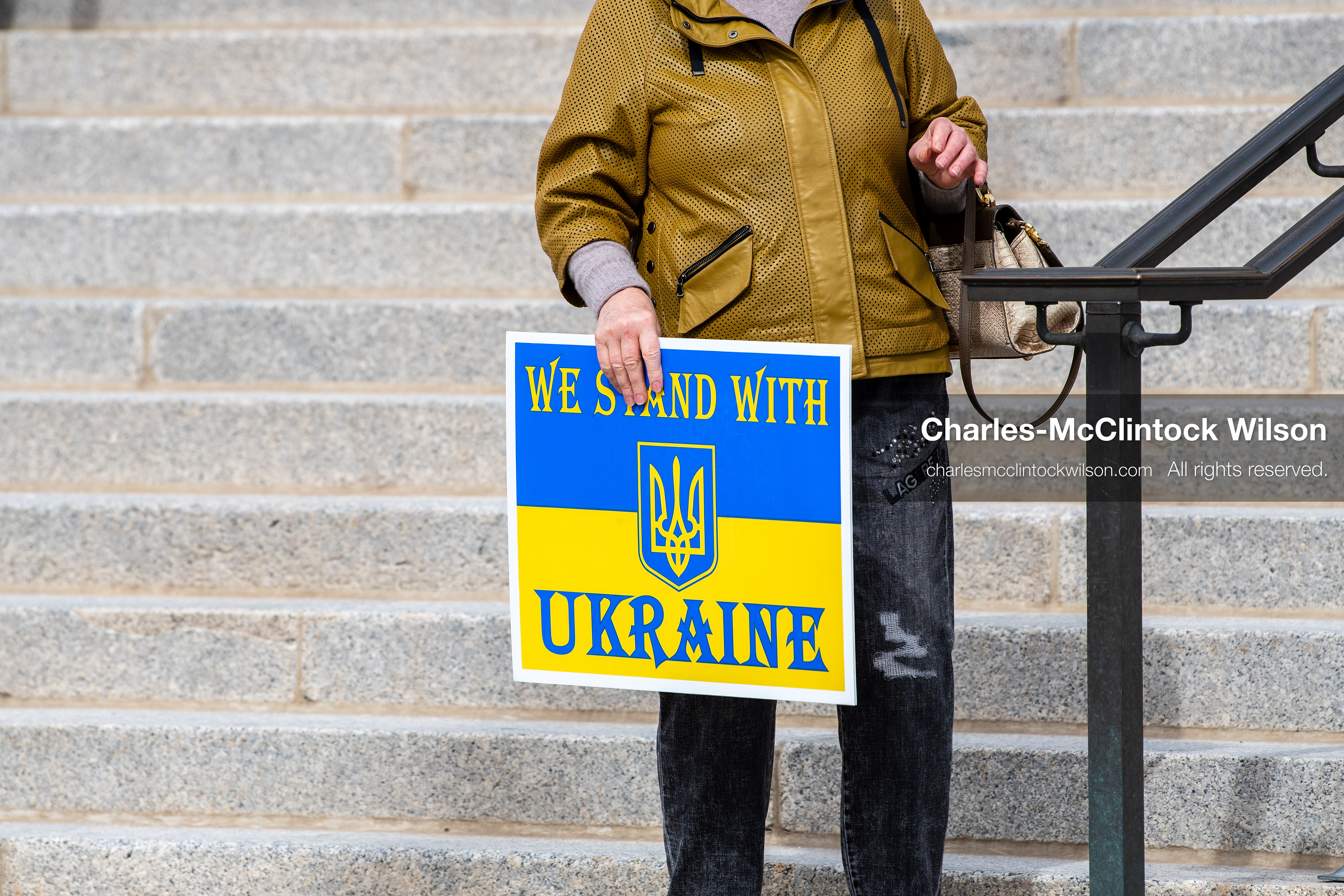 February 28, 2026, Salt Lake City, Utah, USA: A demonstrator holds a sign reading We Stand With Ukraine in the colors of the Ukrainian flag during the Stand With Ukraine rally at the Utah State Capitol. The gathering marked the four year anniversary of the full scale Russian invasion of Ukraine and brought community members together in support of Ukrainians and local humanitarian efforts. (Credit Image: © Charles McClintock Wilson/ZUMA Press Wire)