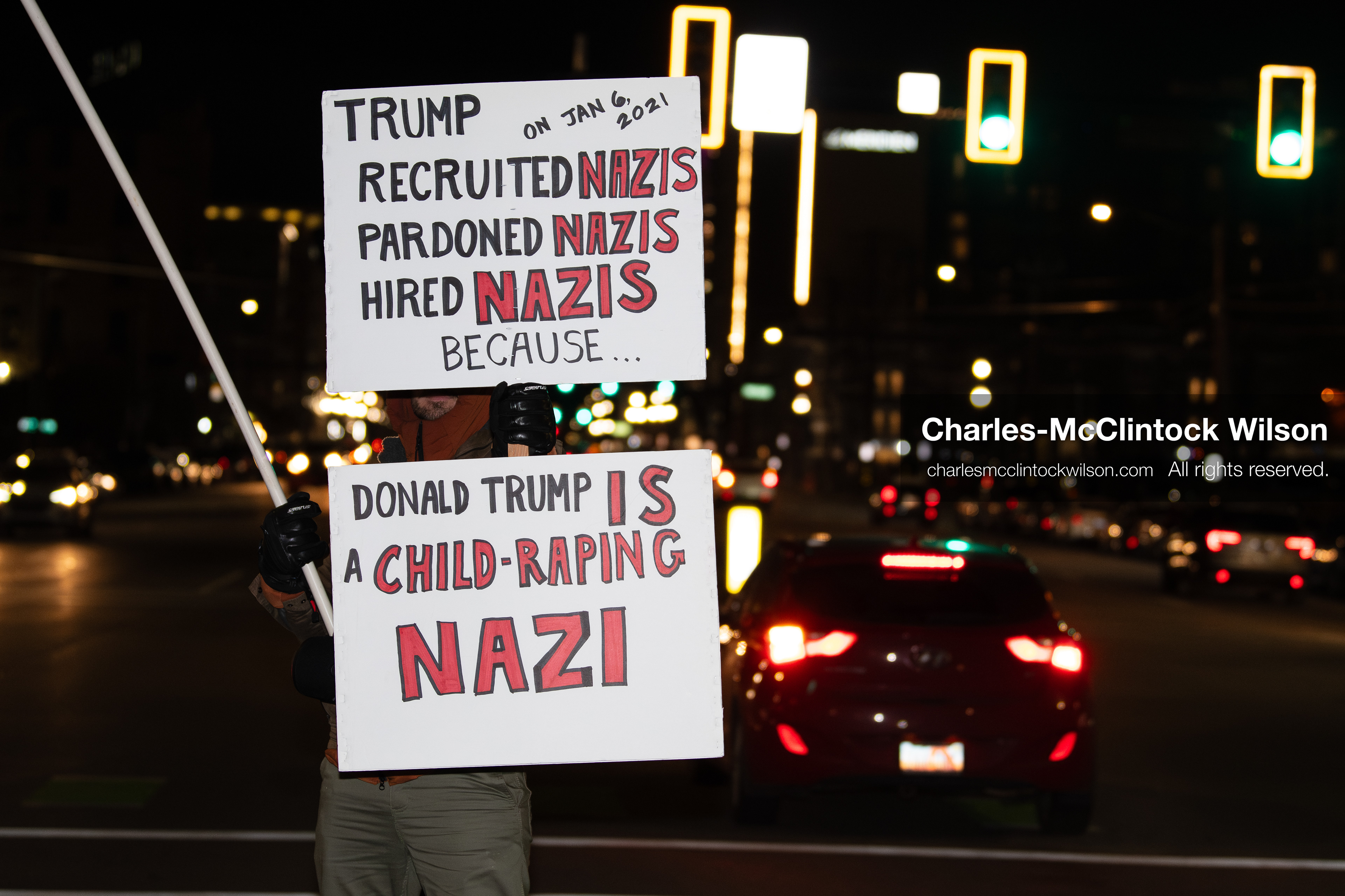 January 8, 2026, Salt Lake City, Utah, USA: A demonstrator holds two signs during an anti ICE protest at Pioneer Park in Salt Lake City Utah on Jan 8 2026. The rally followed the death of Renee Nicole Good a Minneapolis woman who was fatally shot during an encounter with immigration authorities and drew hundreds calling for accountability and changes to enforcement practices. (Credit Image: © Charles-McClintock Wilson/ZUMA Press Wire)