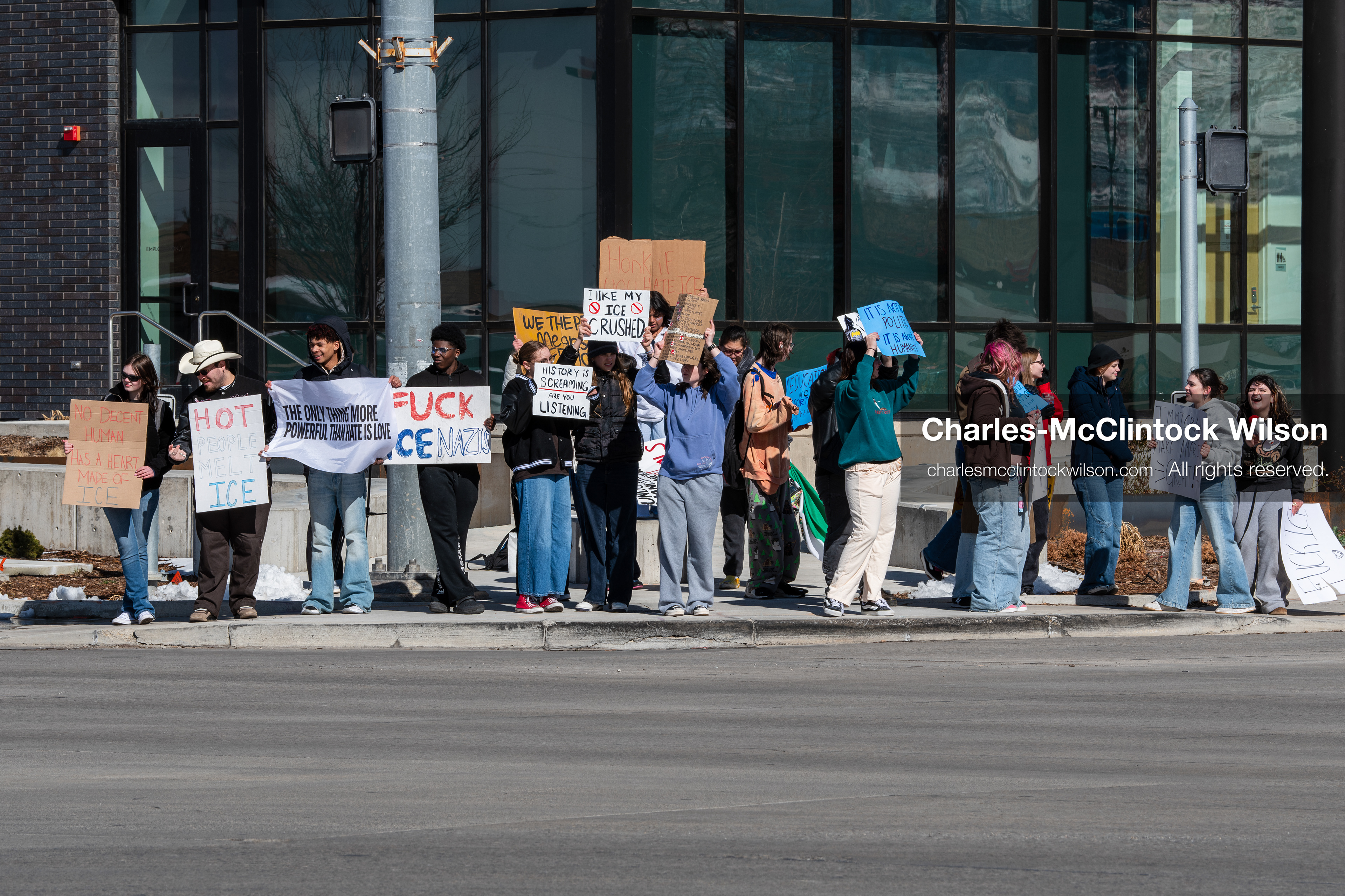 February 20, 2026, Orem, Utah, USA: High school students gather along State Street in front of Orem City Hall during a student led protest against ICE and federal immigration enforcement. Demonstrators hold signs as they stand near the roadway while traffic continues through the area. (Credit Image: © Charles McClintock Wilson/ZUMA Press Wire)