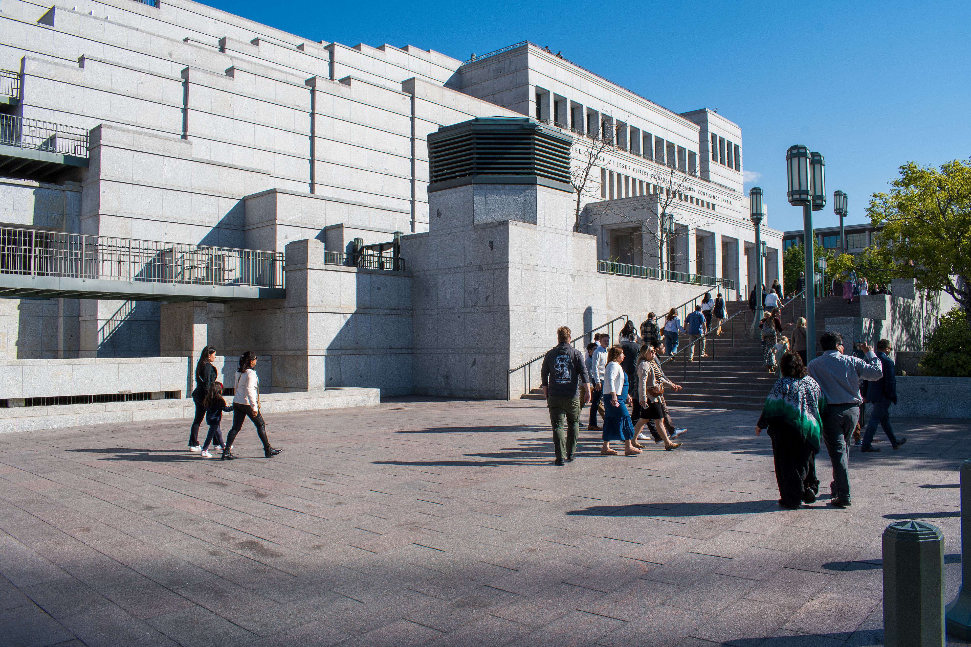 October 6, 2025, Salt Lake City, Utah, USA: People walk through the plaza outside the Conference Center during the public viewing for Russell M. Nelson, the 17th president of the Church of Jesus Christ of Latter-day Saints. Flags fly at half-mast following the death of Nelson at his home in Salt Lake City, Utah, on September 27, 2025, at the age of 101. (Credit Image: © Charles-McClintock Wilson/ZUMA Press Wire)