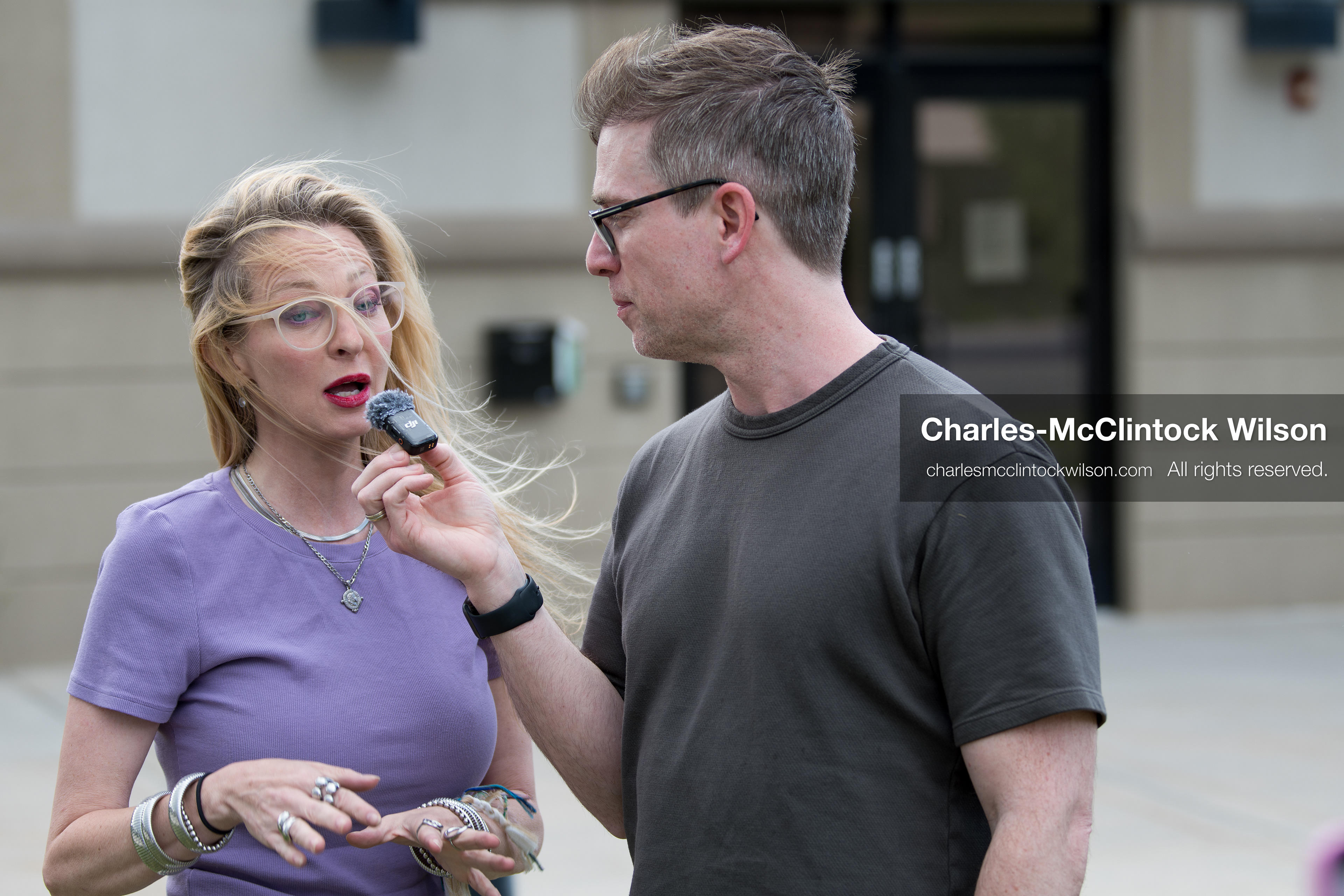 May 13, 2026, Brigham City, Utah, USA: US political satirist and digital creator WALTER MASTERSON interviews a woman outside the Box Elder County Justice Courthouse in Brigham City, Utah, during a gathering over the proposed data‑center project backed by businessman Kevin O’Leary, which has drawn public concern over water use, power demand, and transparency. (Credit Image: © Charles‑McClintock Wilson/ZUMA Press Wire)