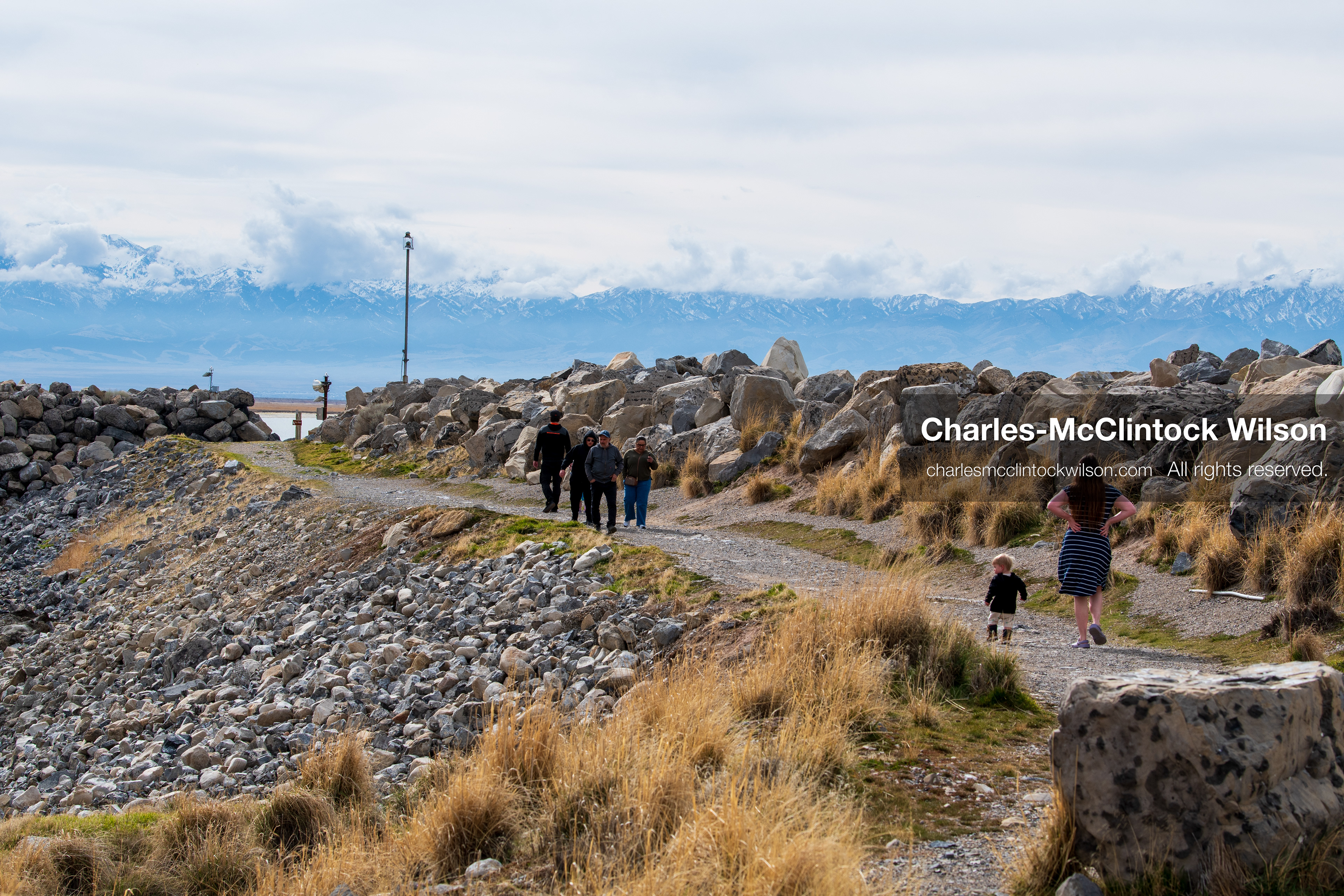 March 1, 2026, Great Salt Lake, Utah, USA: People walk along a path near the Great Salt Lake at a trail access point as water levels in the region remain historically low. Reports from state officials and the Great Salt Lake Strike Team state that the lake continues to fall within a serious adverse‑effects range, with elevations among the lowest recorded in more than one hundred years. The lake has drawn increased public attention as lawmakers discuss large‑scale water projects and long‑term plans to address declining conditions. (Credit Image: © Charles‑McClintock Wilson/ZUMA Press Wire)