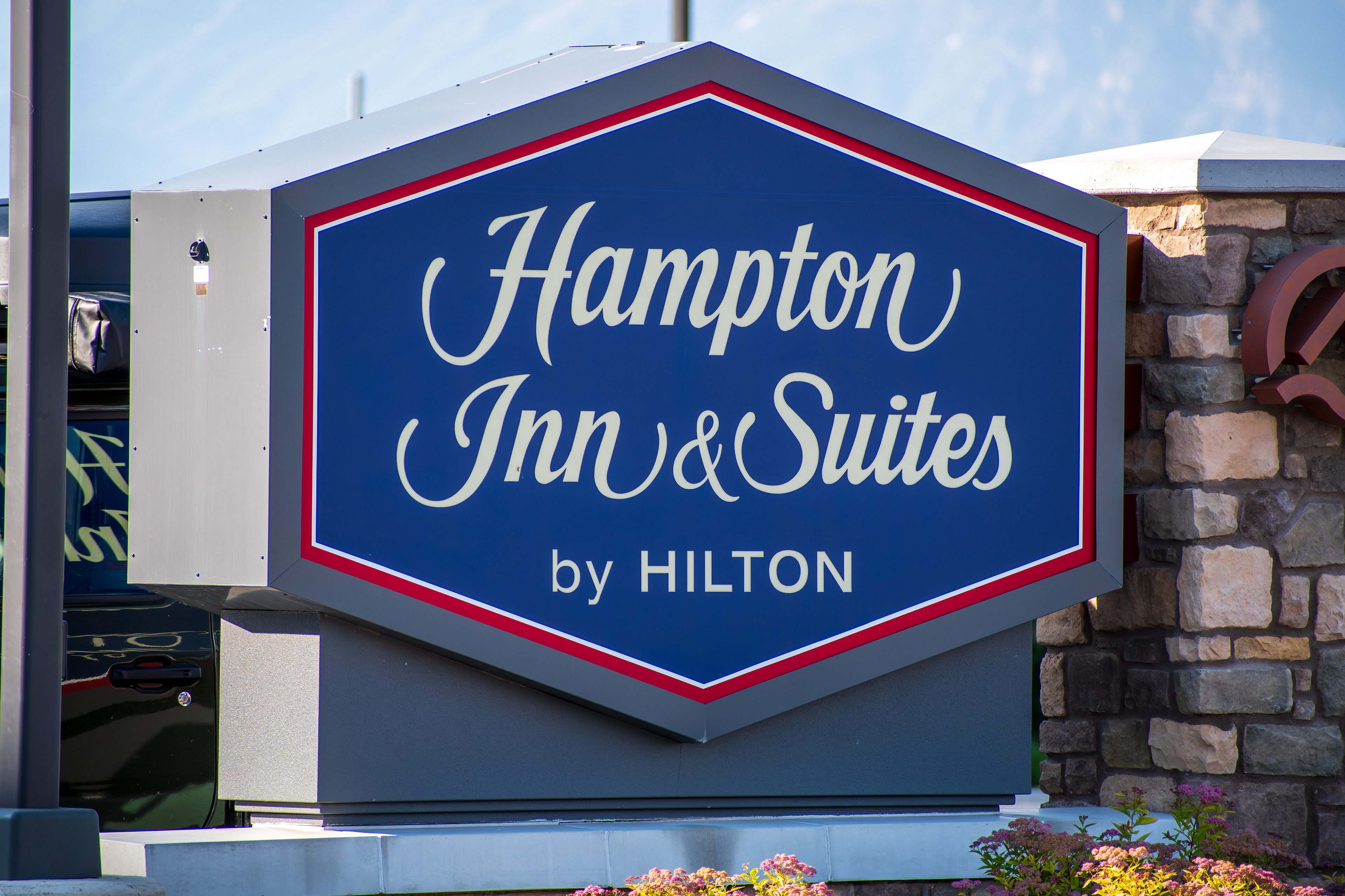 SPANISH FORK, UTAH, USA - JUNE 8, 2025: Exterior view of a Hampton Inn. Hampton Inn is an American chain of hotels trademarked by Hilton Worldwide.