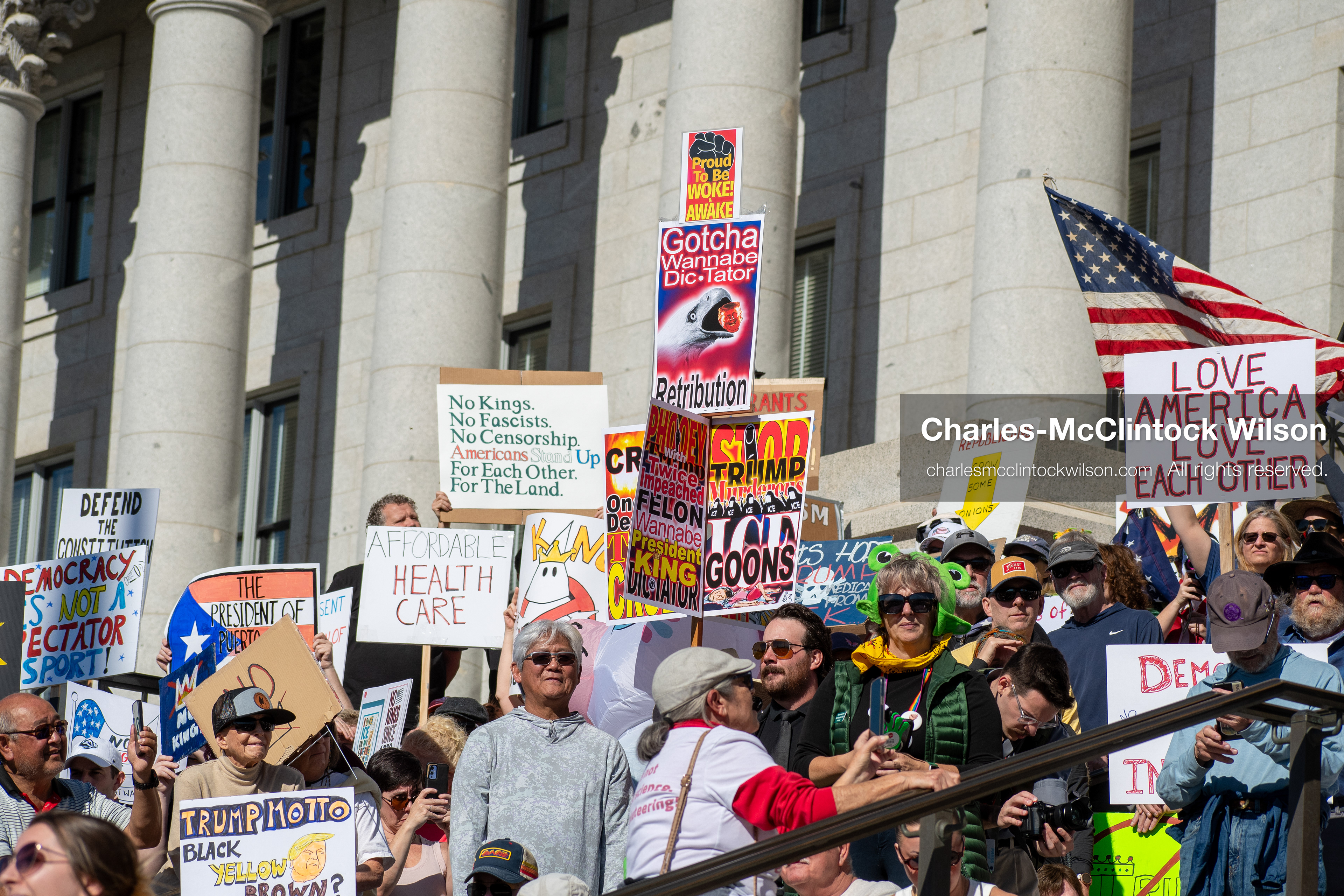 October 18, 2025, Salt Lake City, Utah, USA: Demonstrators participate in a "No Kings" protest held at the Utah State Capitol. Participants hold signs and flags during the public gathering.