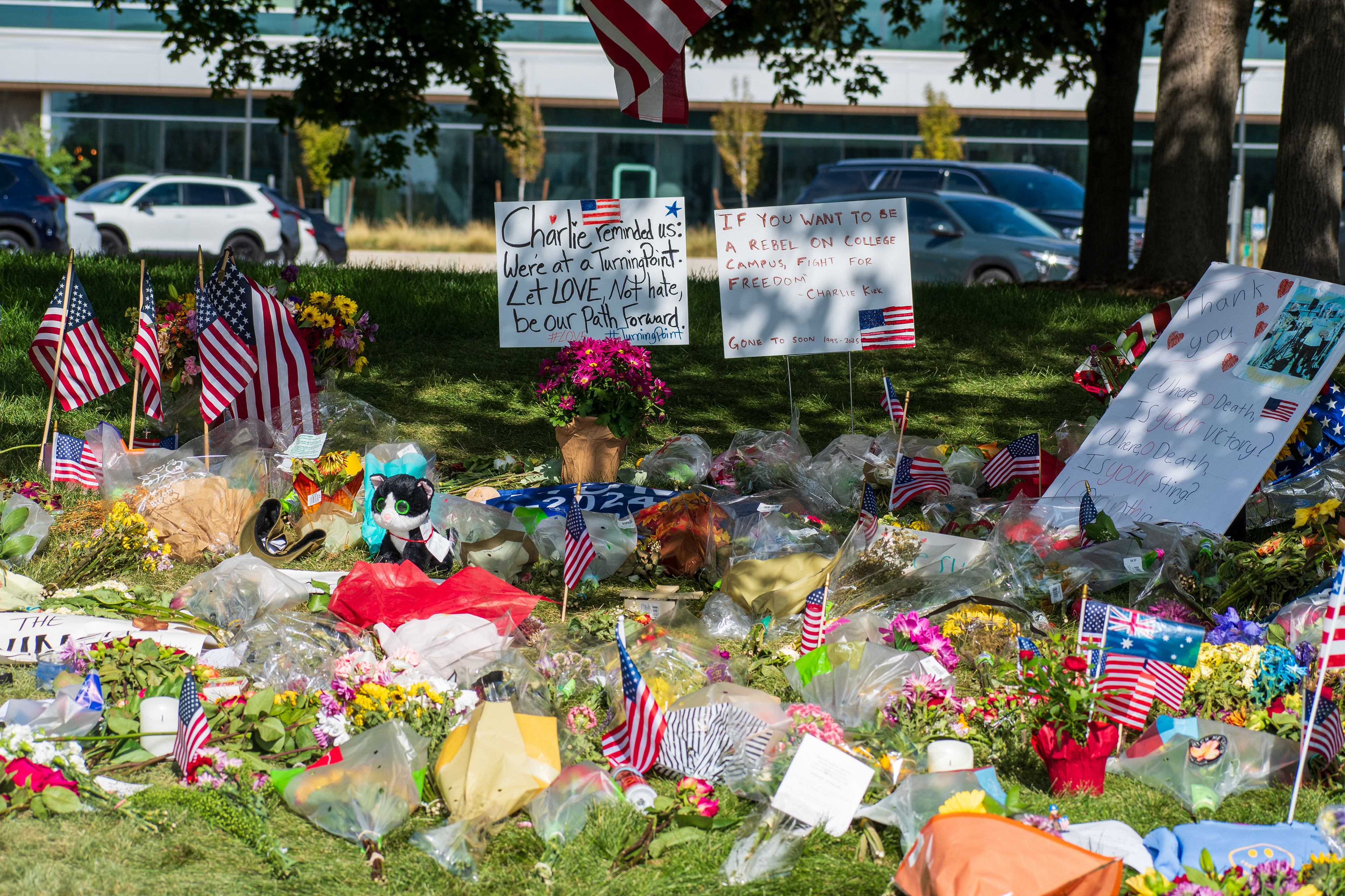 OREM, UTAH – SEPTEMBER 15, 2025: A memorial honoring Charlie Kirk is seen on the campus of Utah Valley University, featuring American flags, candles, flowers, and handwritten signs arranged around a large portrait. The tribute appeared days after Kirk’s final public event at the university. © Charles‑McClintock Wilson / ZUMA Press
