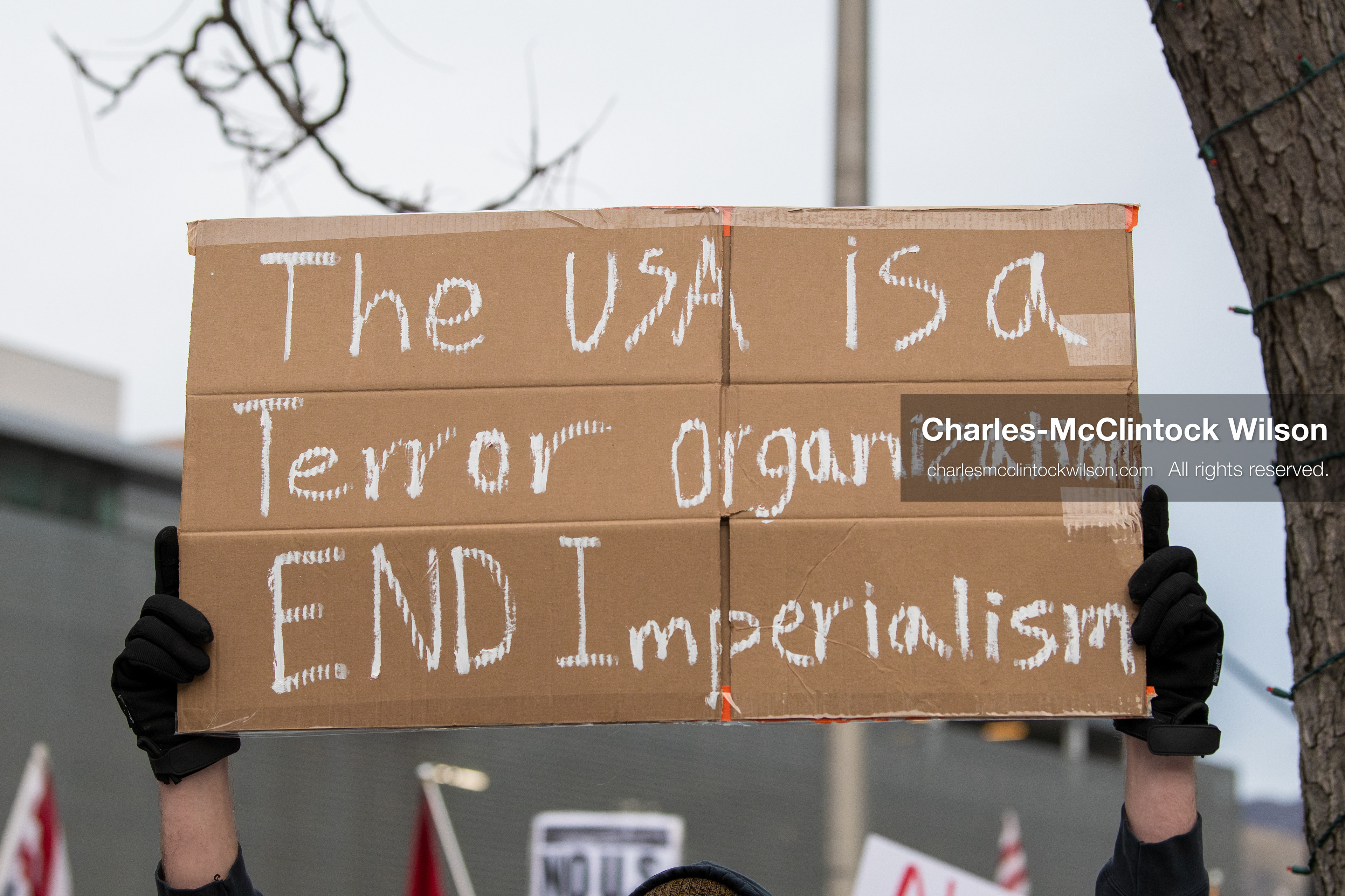 January 3, 2026, Salt Lake City, Utah, USA: A protester holds a sign during a demonstration against US action in Venezuela outside the Wallace Federal Building in Salt Lake City, Utah. The protest was part of a nationwide mobilization responding to recent military developments. (Credit Image: (c) Charles‑McClintock Wilson/ZUMA Press Wire)