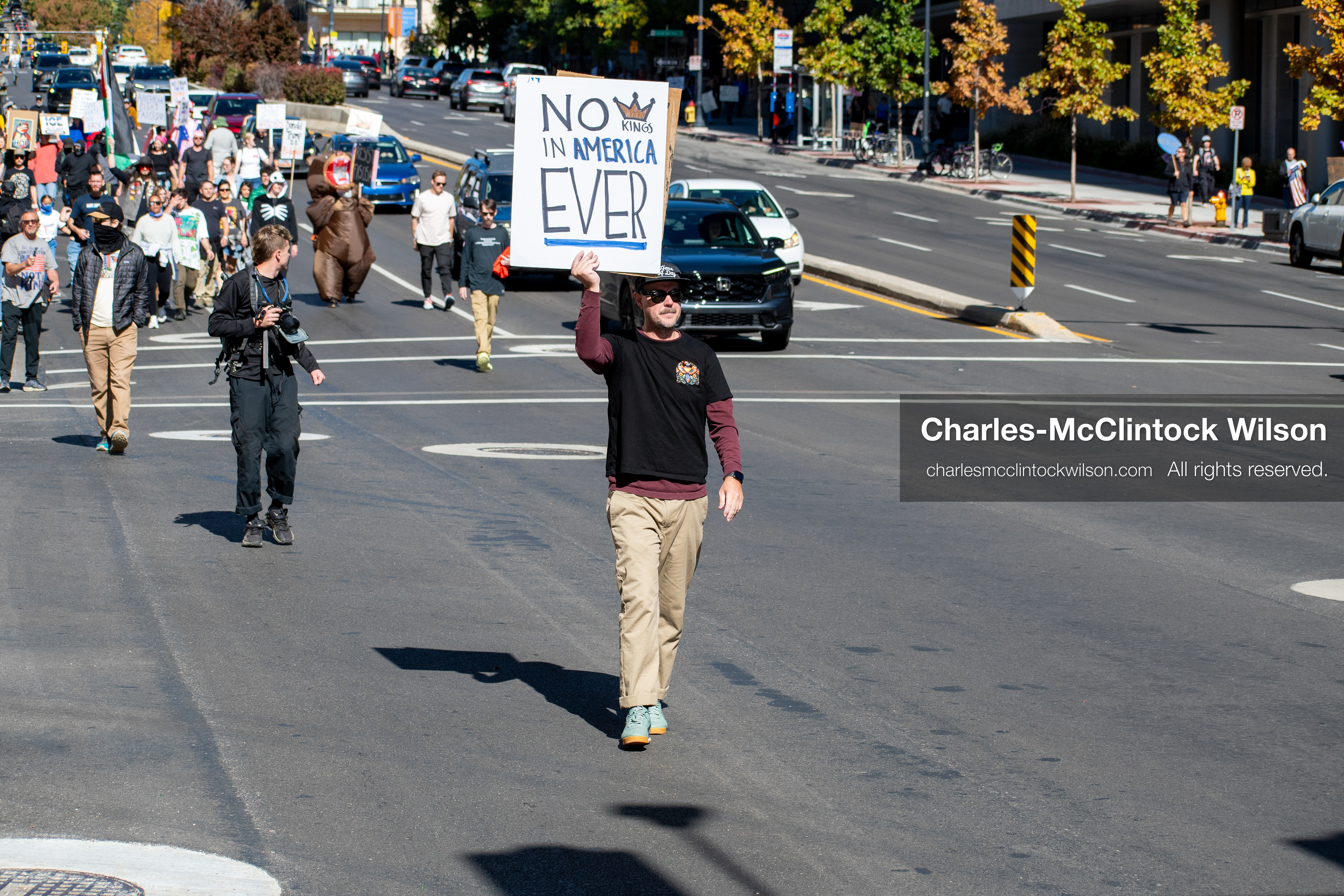 October 18, 2025, Salt Lake City, Utah, USA: Demonstrators march along South State Street during a "No Kings" protest in Salt Lake City, Utah. The protest was part of a nationwide mobilization.