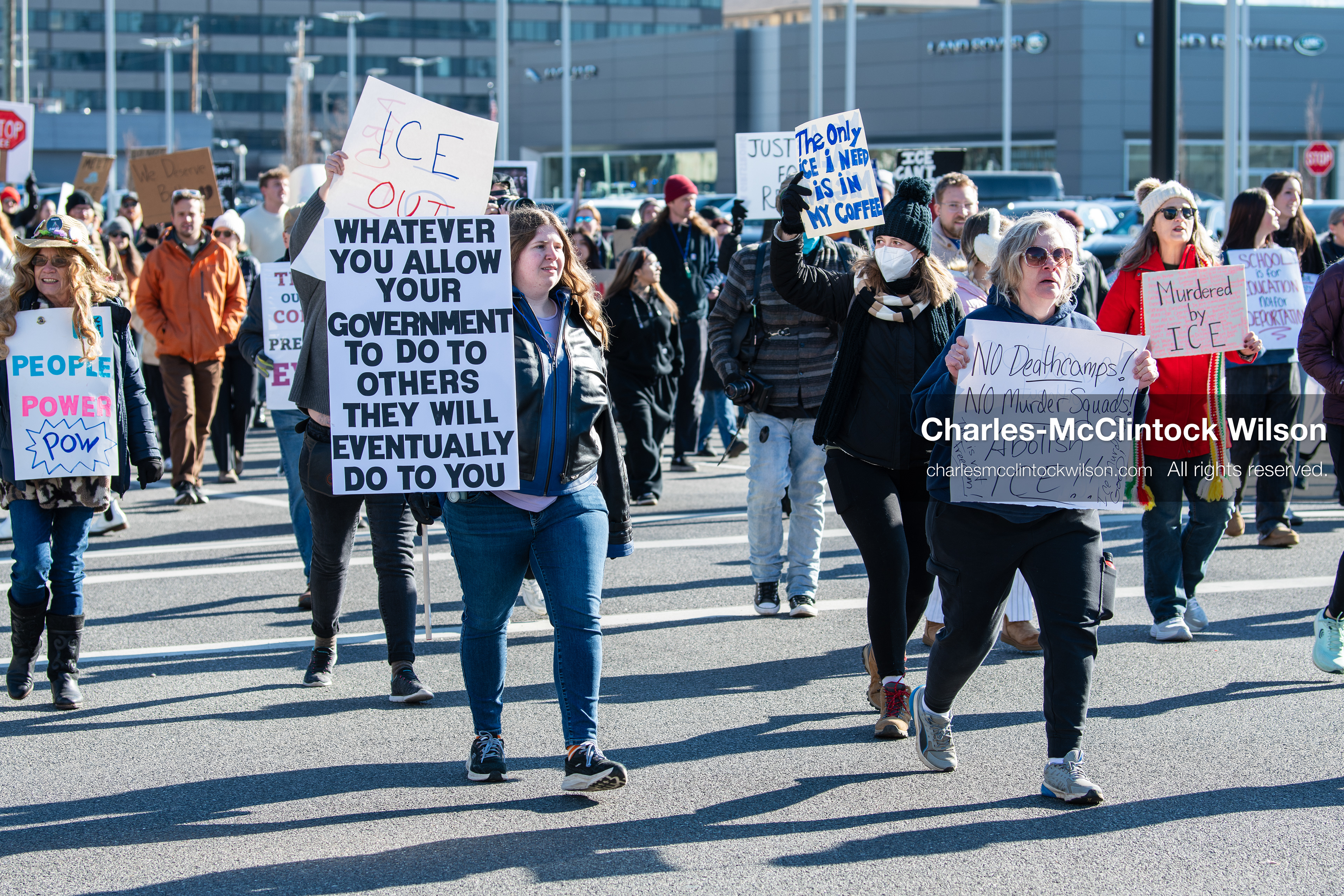 Salt Lake City, Utah, January 10, 2026: A group of demonstrators marches through downtown Salt Lake City during the ICE Out for Good protest, which began at Washington Square Park, with participants carrying signs and personal items as they walk together. (Credit Image: © Charles‑McClintock Wilson/ZUMA Press Wire)