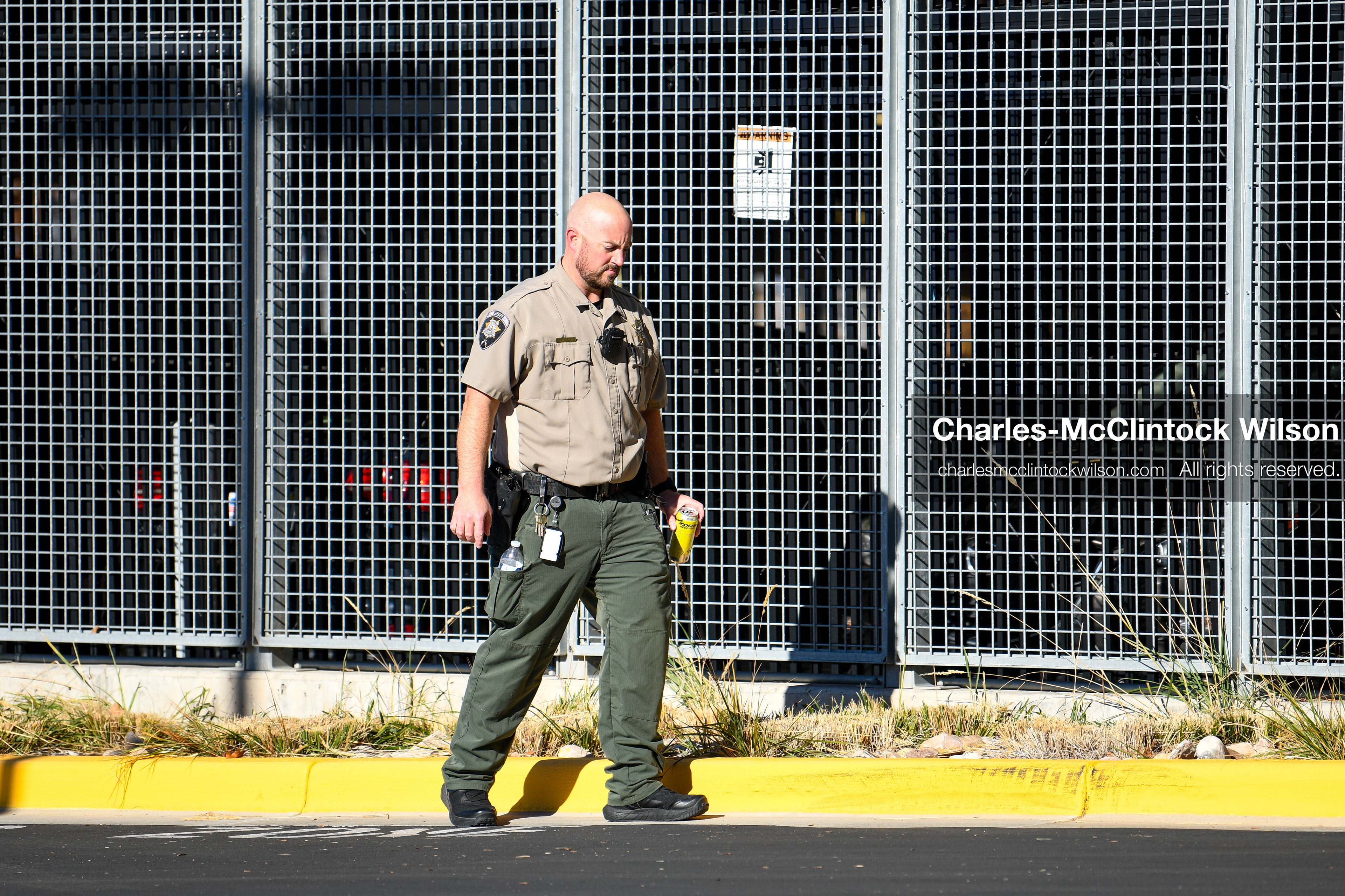 PROVO, UTAH, USA – DECEMBER 11, 2025: A Utah County Sheriff’s Office officer patrols the parking lot of the Fourth District Court in Provo during the first in‑person court appearance of Tyler Robinson in the Charlie Kirk murder case. (Credit Image: © Charles‑McClintock Wilson/ZUMA Press Wire)