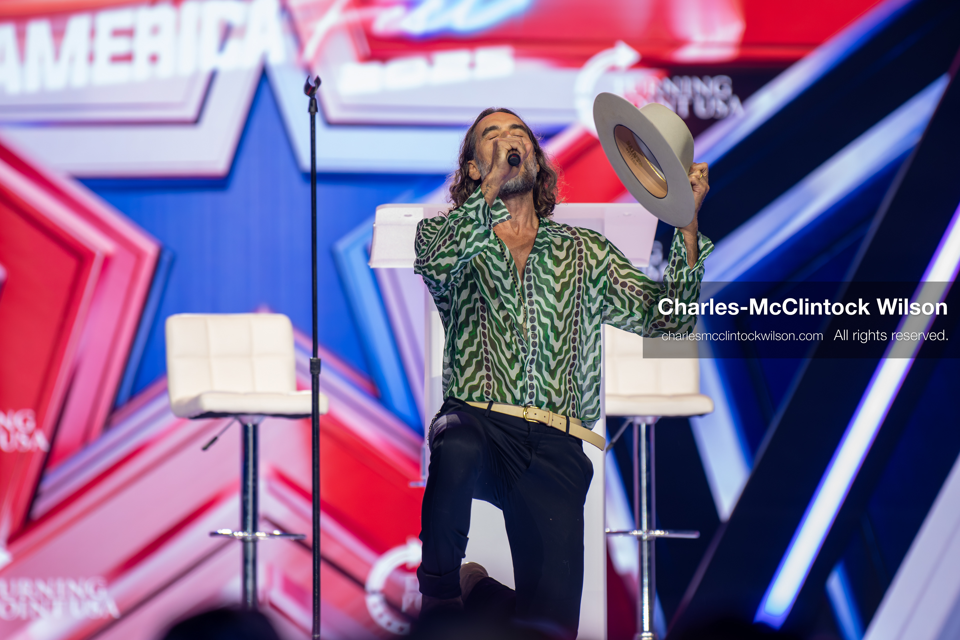 December 18, 2025, Phoenix, Arizona, USA: Russell Brand speaks during Day One of Turning Point USA’s AmericaFest 2025 at the Phoenix Convention Center in Phoenix, Arizona.   (Credit Image: © Charles‑McClintock Wilson/ZUMA Press Wire)