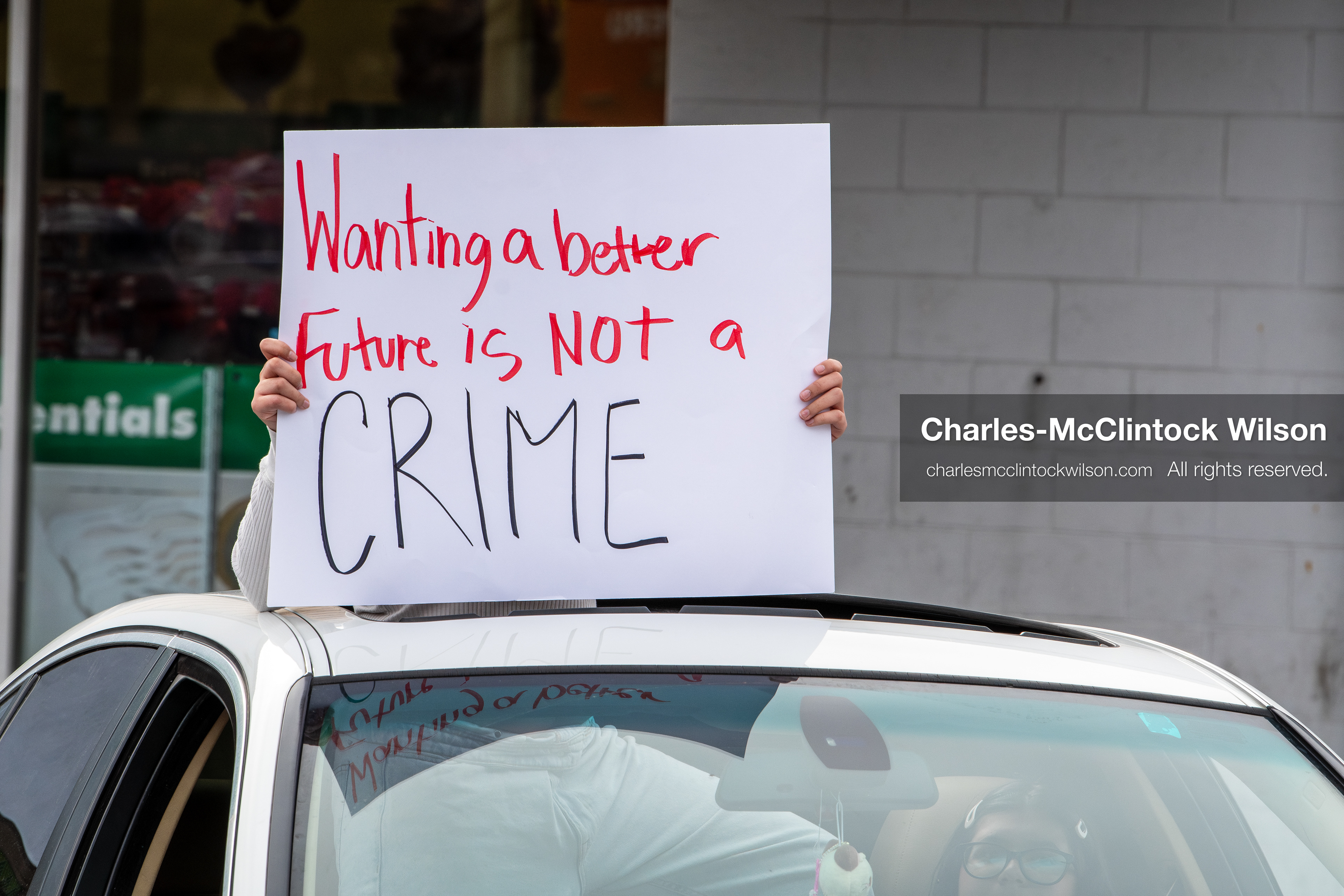 February 11, 2026, Orem, Utah, USA: A student leans out of a car window while participating in a student‑led protest involving participants from multiple Orem schools. (Credit Image: © Charles‑McClintock Wilson/ZUMA Press Wire)