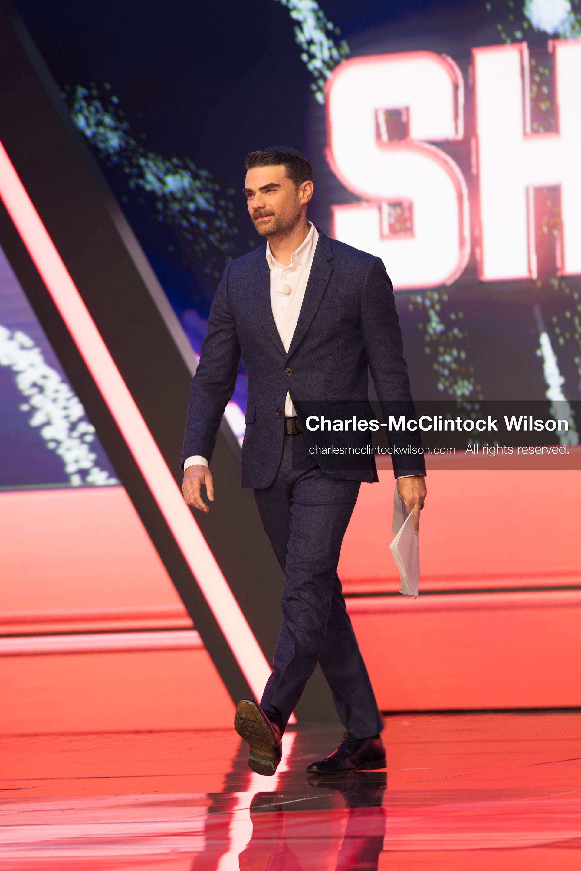 December 18, 2025, Phoenix, Arizona, USA: Ben Shapiro walks toward the stage during Day One of Turning Point USA’s AmericaFest 2025 at the Phoenix Convention Center in Phoenix, Arizona.