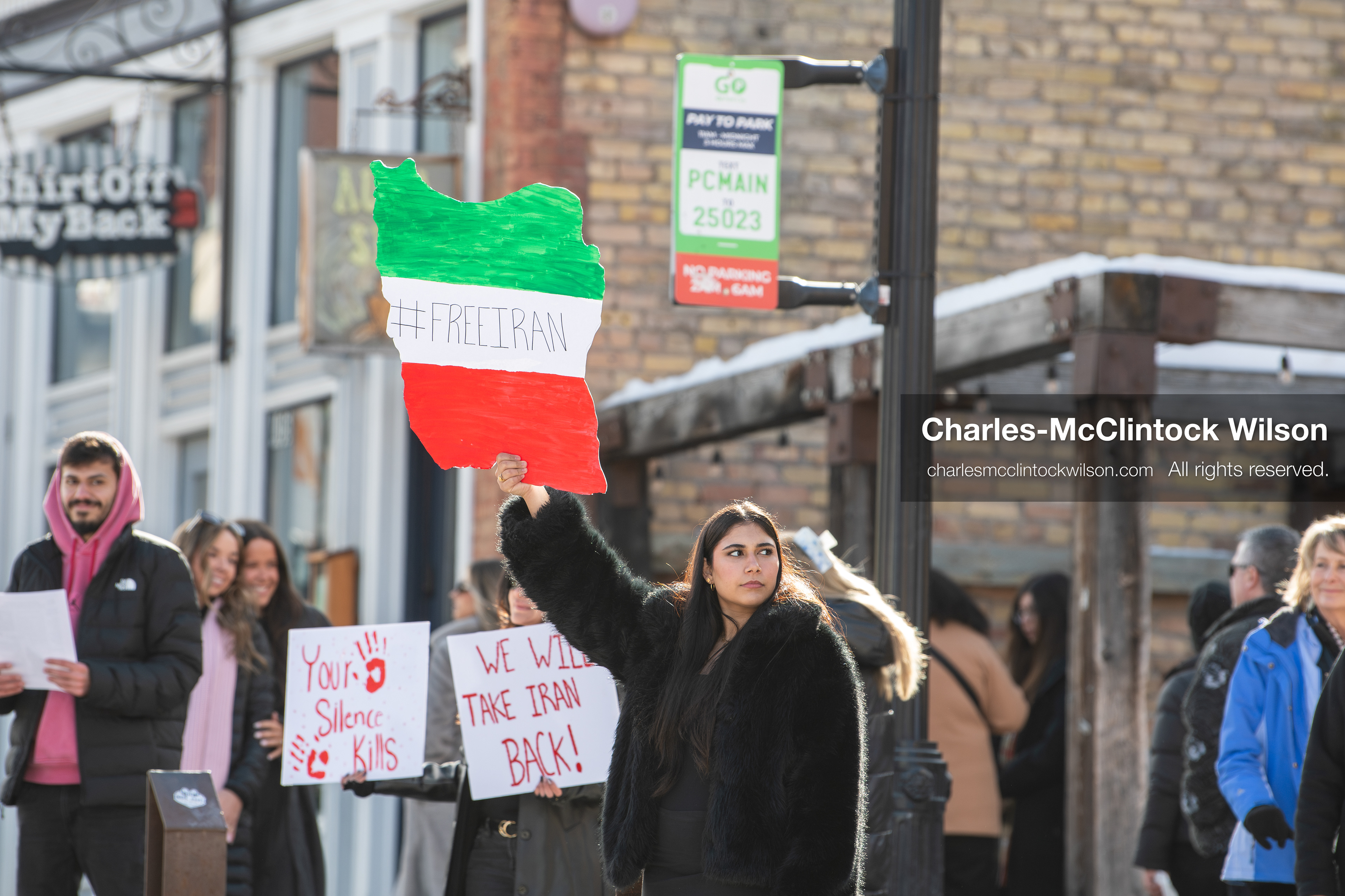 January 30, 2026, Park City, Utah, USA: Demonstrators hold signs during a small protest against the Iranian government on Main Street in Park City, Utah. (Credit Image: © Charles McClintock Wilson/ZUMA Press Wire)