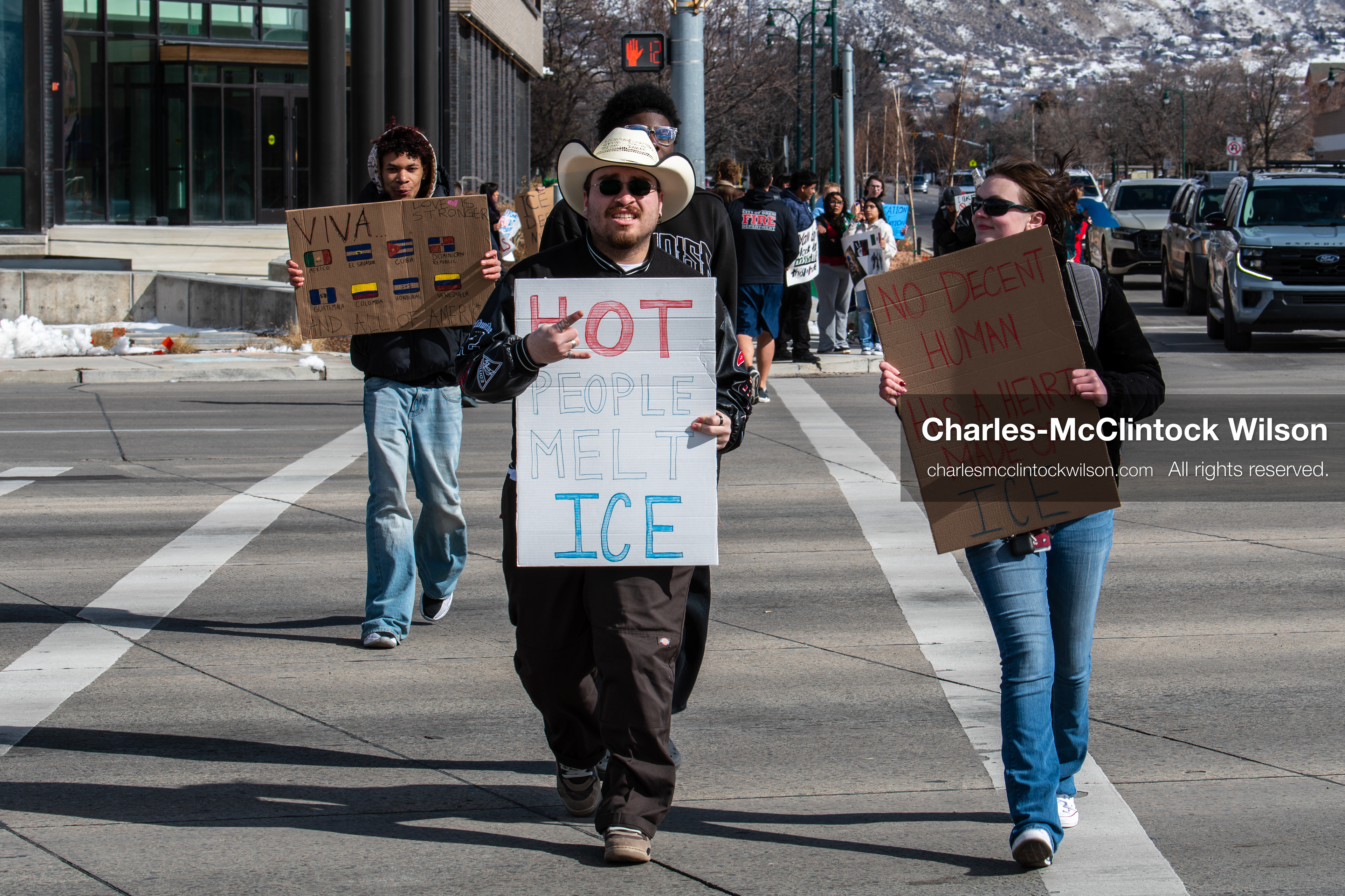 February 20, 2026, Orem, Utah, USA: Participants cross State Street in front of Orem City Hall during a student led protest against ICE. Demonstrators move through the crosswalk as vehicles wait in the area. (Credit Image: © Charles McClintock Wilson/ZUMA Press Wire)