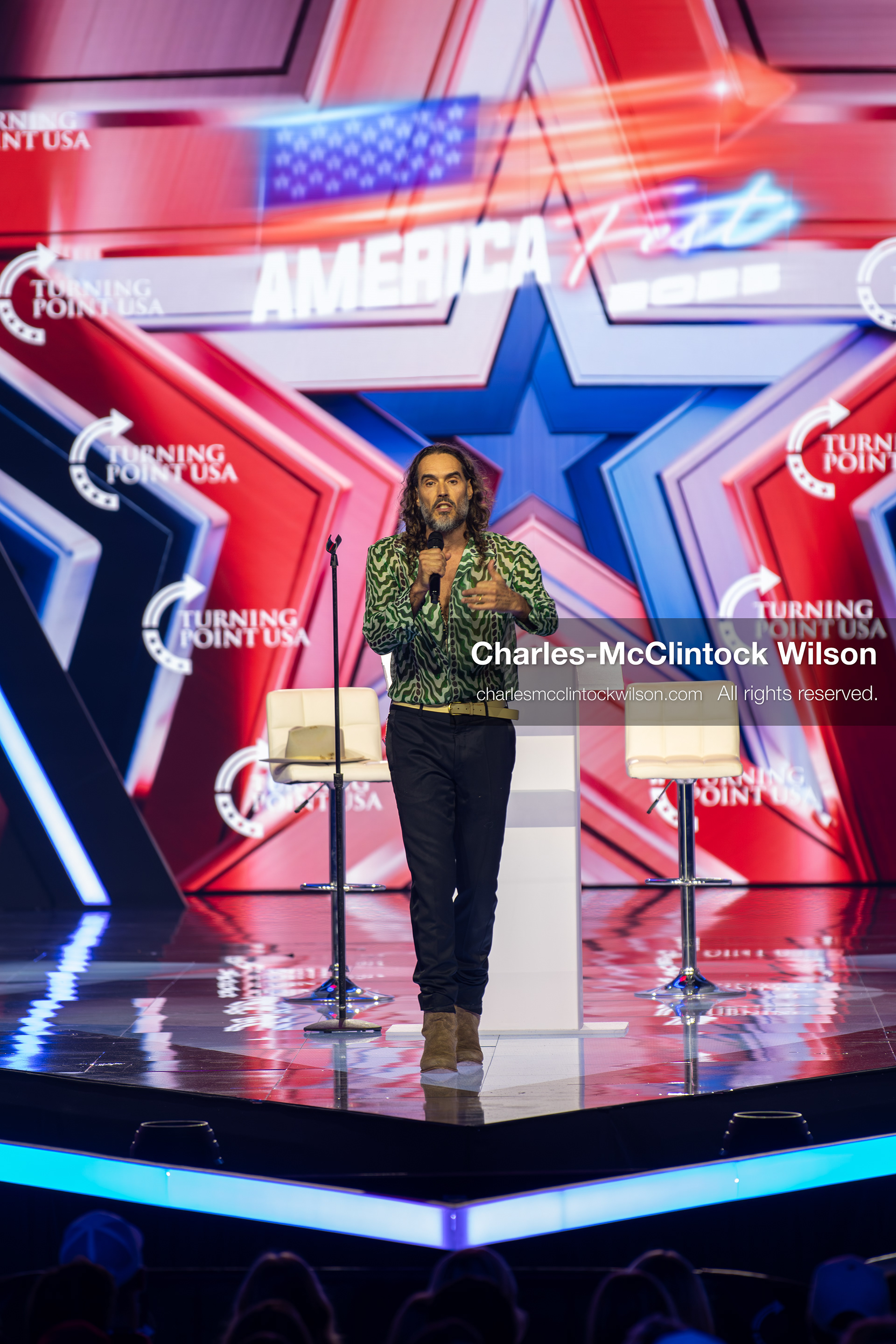 December 18, 2025, Phoenix, Arizona, USA: Russell Brand speaks during Day One of Turning Point USA’s AmericaFest 2025 at the Phoenix Convention Center in Phoenix, Arizona.   (Credit Image: © Charles‑McClintock Wilson/ZUMA Press Wire)