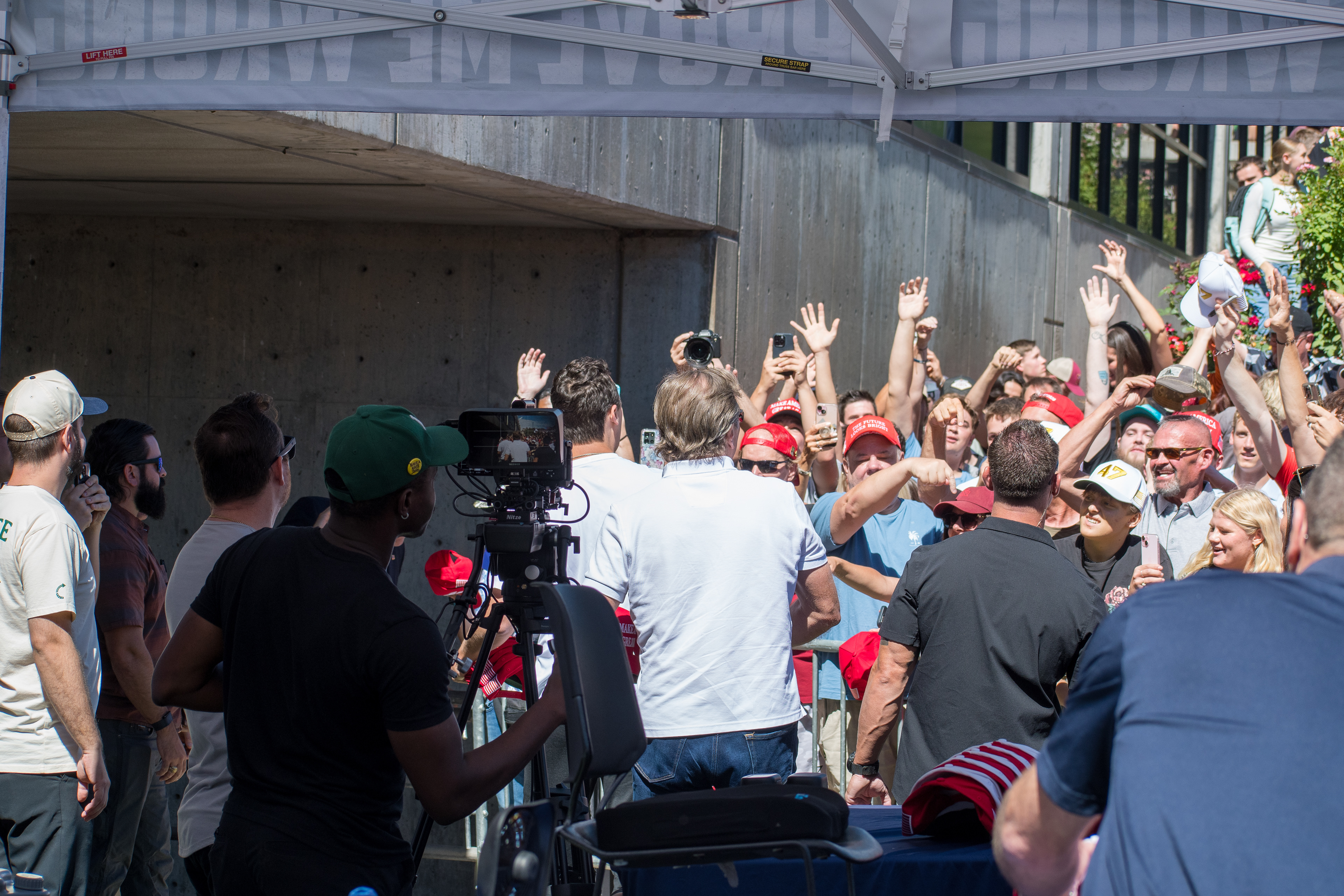OREM, UTAH – SEPTEMBER 10, 2025: Charlie Kirk greets supporters during a public appearance at Utah Valley University. Surrounded by an energized crowd, Kirk moves through the gathering in a moment of direct engagement and civic enthusiasm. The image captures the atmosphere of connection and conviction that defined his final public appearance. © Charles-McClintock Wilson / ZUMA Press