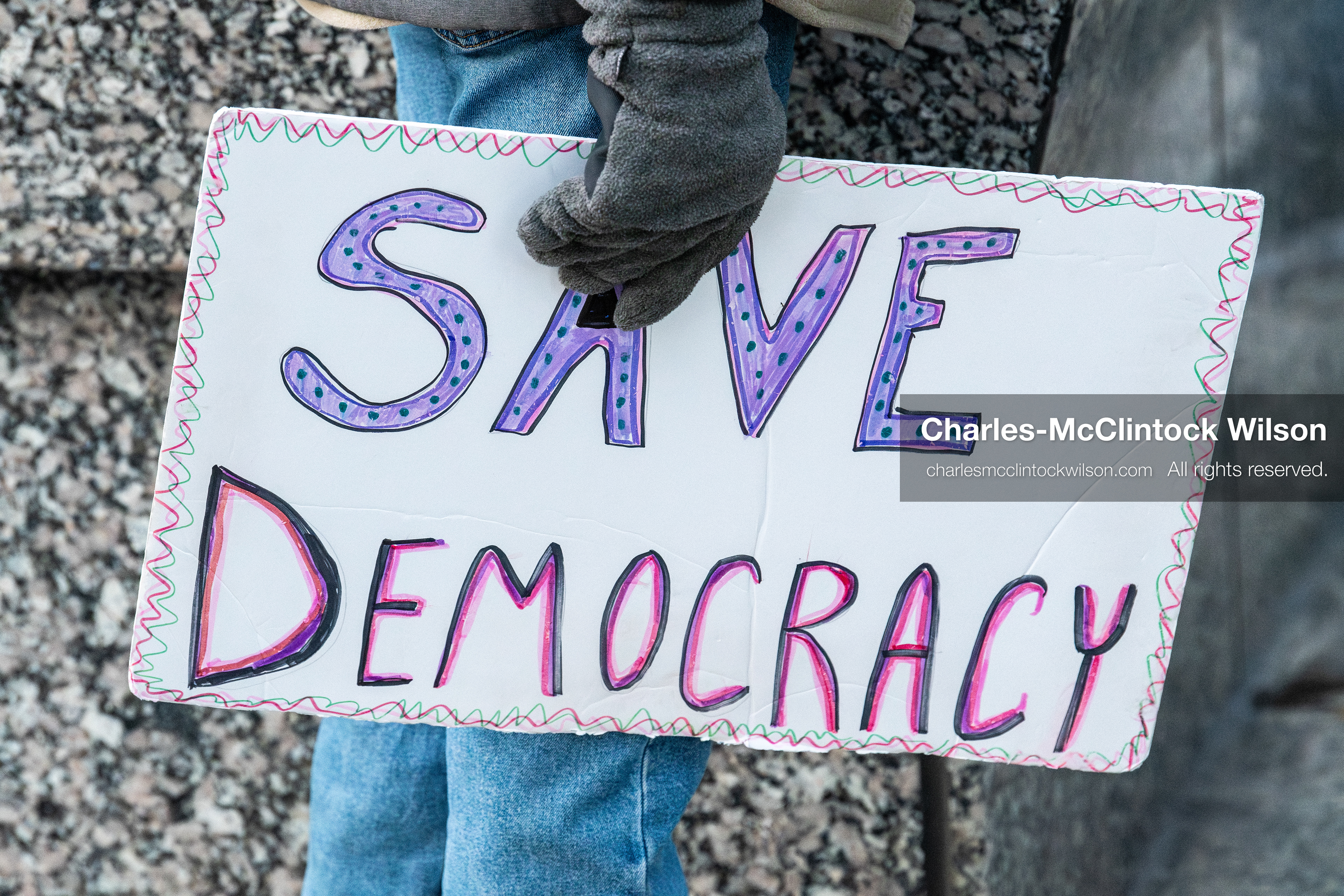 January 5, 2026, Salt Lake City, Utah, USA: A demonstrator holds a sign during a protest outside the Wallace Federal Building in Salt Lake City, Utah. The rally, organized by Salt Lake Indivisible, called for congressional limits on presidential war powers following recent US military actions in Venezuela involving the government of Nicolas Maduro. (Credit Image: (c) Charles‑McClintock Wilson/ZUMA Press Wire)