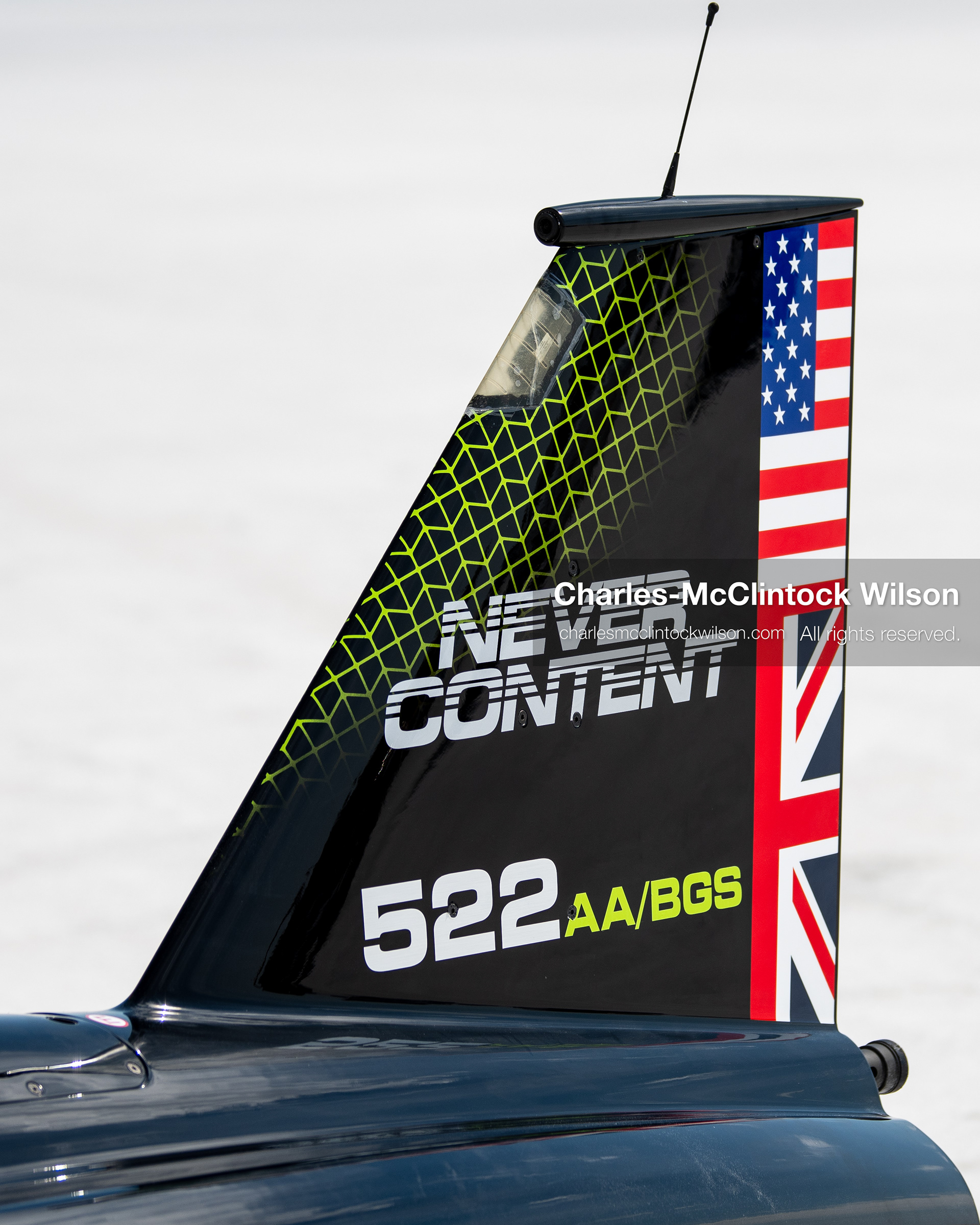  August 11, 2026, Wendover, Utah, USA: A close-up shot shows the tail fin of the hydrogen-powered ''JCB Hydromax'' streamliner on the Bonneville Salt Flats on Tuesday. The vehicle features the text ''NEVER CONTENT'' and flag graphics alongside racing number 522 AA/BGS, marking a historic record-breaking top speed run of 406.320 mph. (Credit Image: © Charles McClintock Wilson/ZUMA Press Wire)