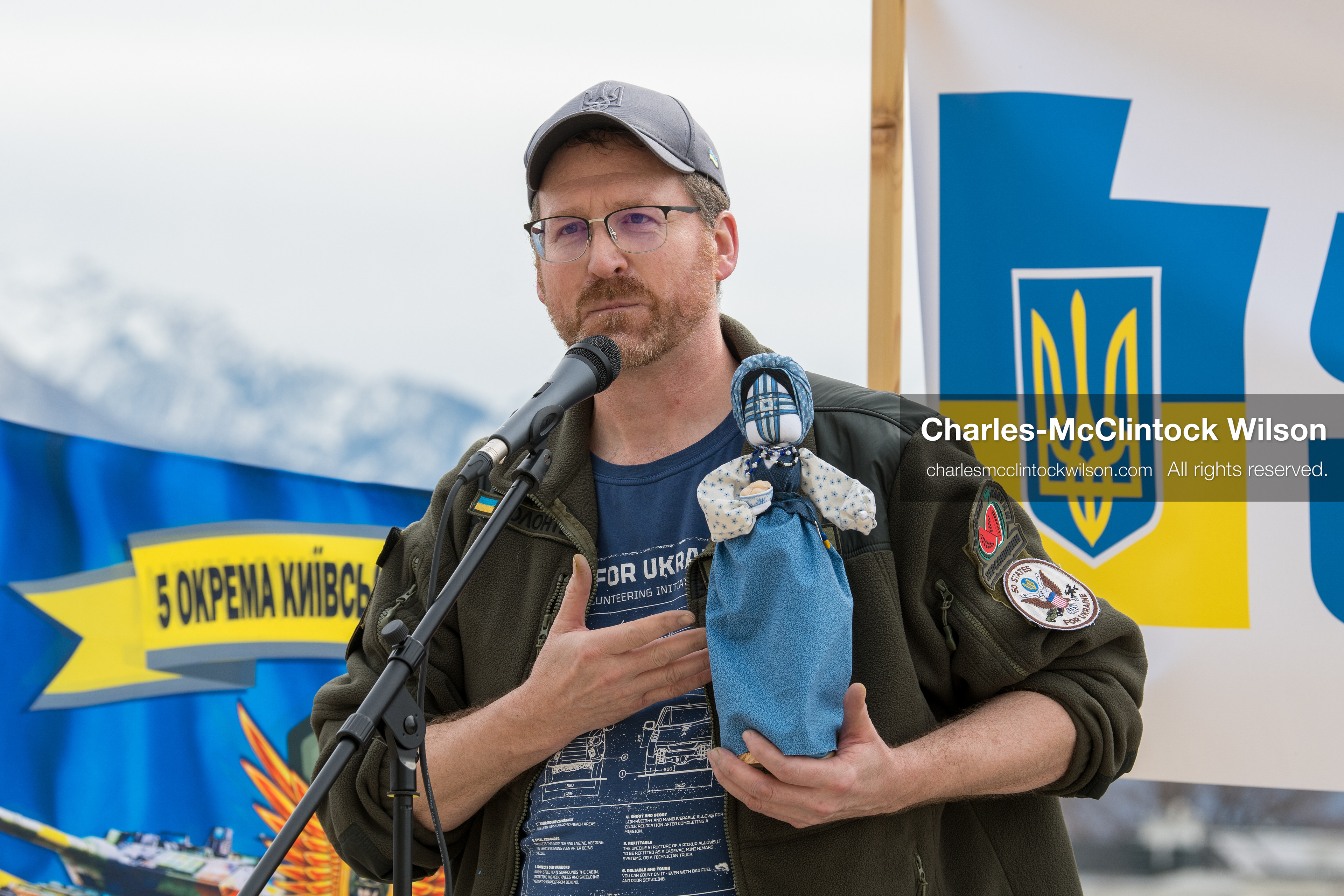 February 28, 2026, Salt Lake City, Utah, USA: NATHANIEL SANDERS, a Salt Lake County Deputy District Attorney and a vocal advocate for Ukraine, speaks while holding a traditional Ukrainian motanka doll, a handmade protective symbol, during the Stand With Ukraine rally at the Utah State Capitol. The event marked the four year anniversary of the full scale Russian invasion of Ukraine and brought community members together in support of Ukrainians and local humanitarian efforts. (Credit Image: © Charles McClintock Wilson/ZUMA Press Wire)