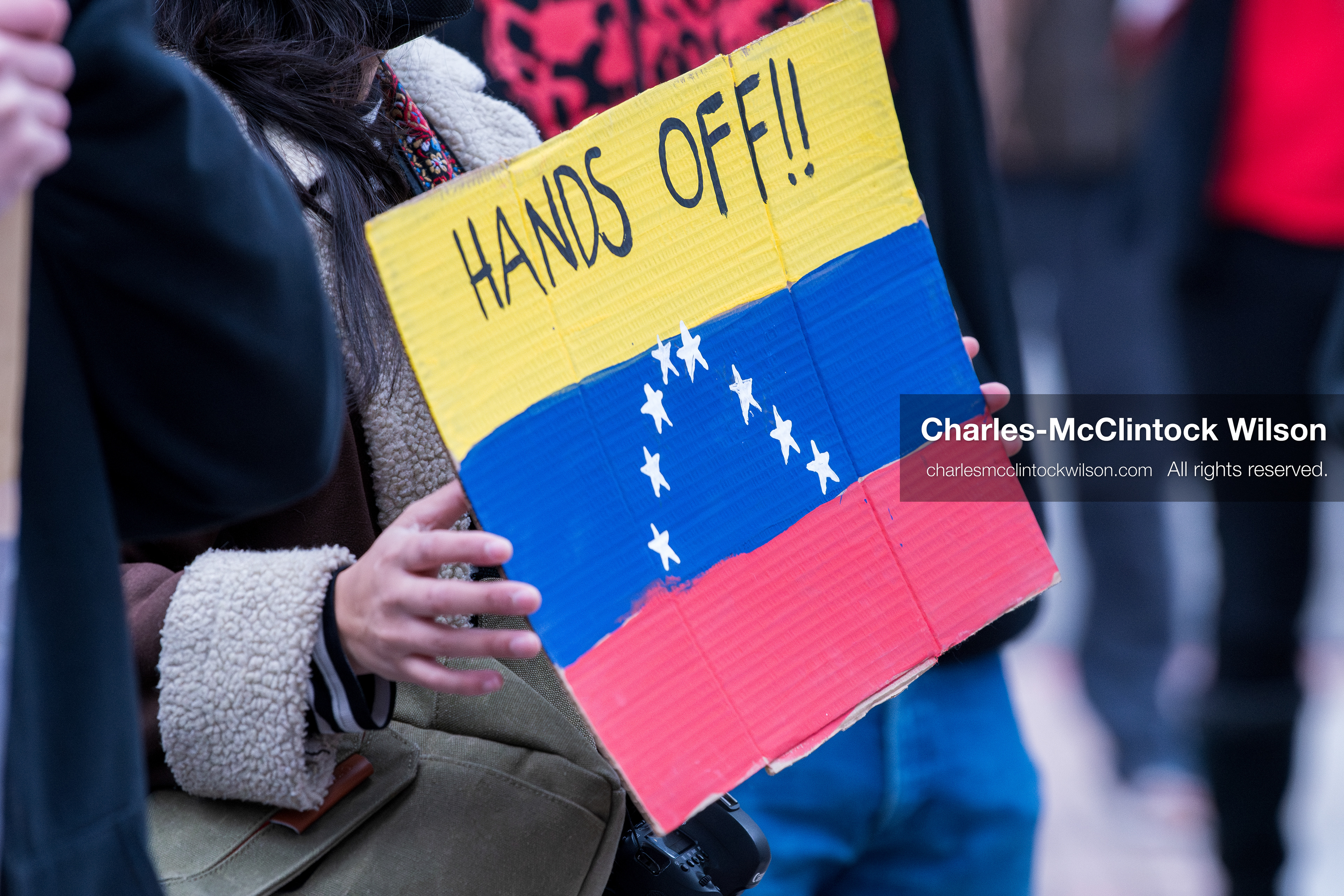 January 3, 2026, Salt Lake City, Utah, USA: A protester holds a sign during a demonstration against US action in Venezuela outside the Wallace Federal Building in Salt Lake City, Utah. The protest was part of a nationwide mobilization responding to recent military developments. (Credit Image: (c) Charles‑McClintock Wilson/ZUMA Press Wire)