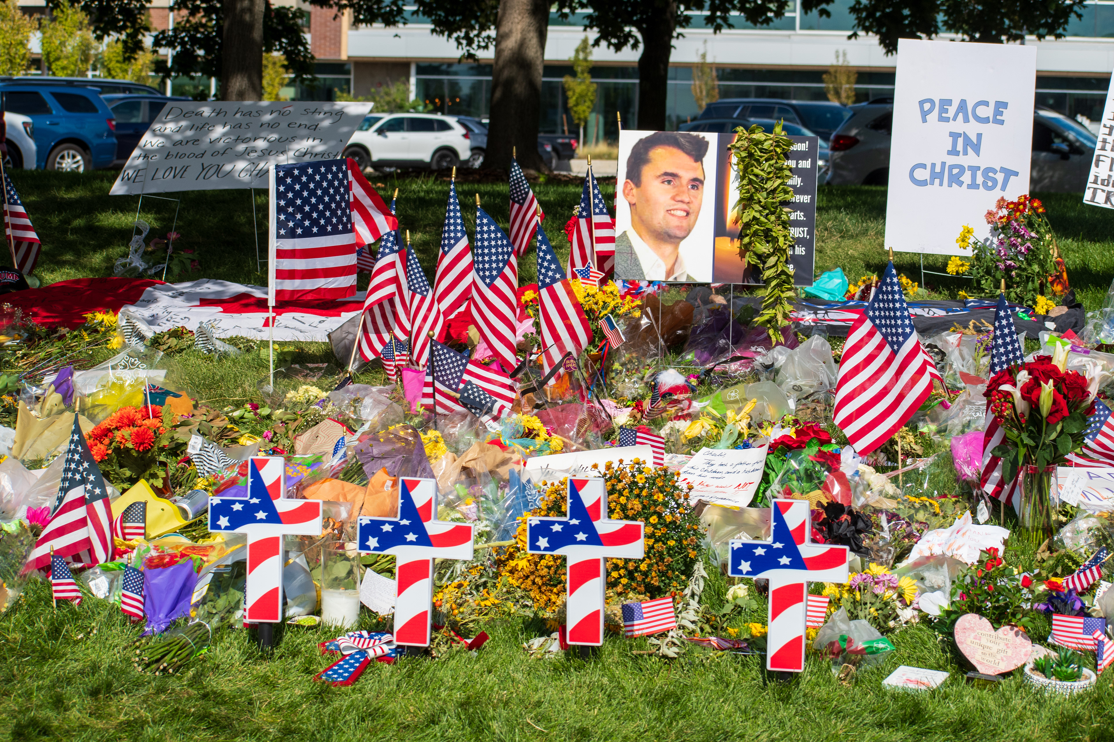 OREM, UTAH – SEPTEMBER 15, 2025: A memorial honoring Charlie Kirk is seen on the campus of Utah Valley University, featuring American flags, candles, flowers, and handwritten signs arranged around a large portrait. The tribute appeared days after Kirk’s final public event at the university. © Charles‑McClintock Wilson / ZUMA Press