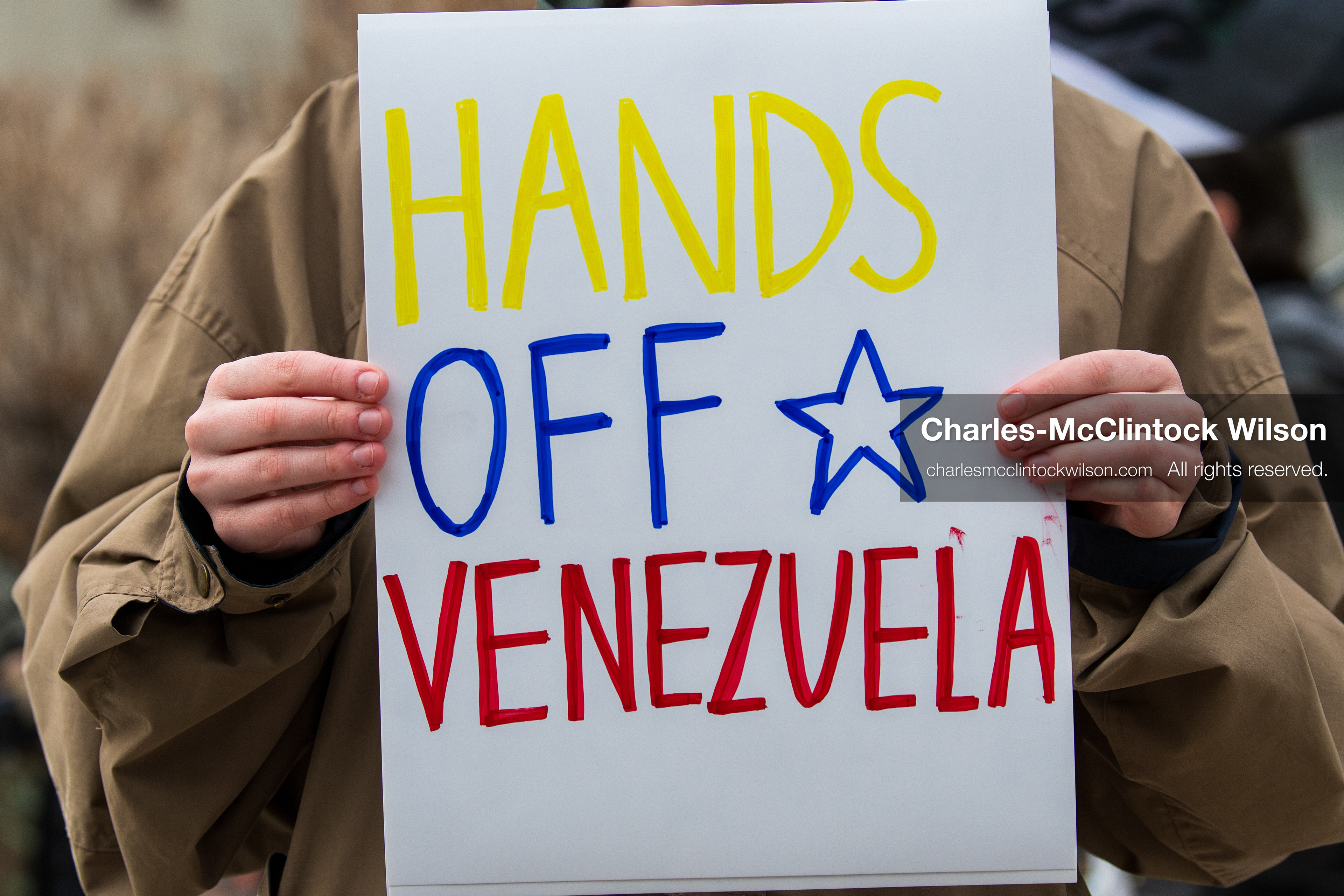 January 3, 2026, Salt Lake City, Utah, USA: A protester holds a sign during a demonstration against US action in Venezuela outside the Wallace Federal Building in Salt Lake City, Utah. The protest was part of a nationwide mobilization responding to recent military developments. (Credit Image: (c) Charles‑McClintock Wilson/ZUMA Press Wire)