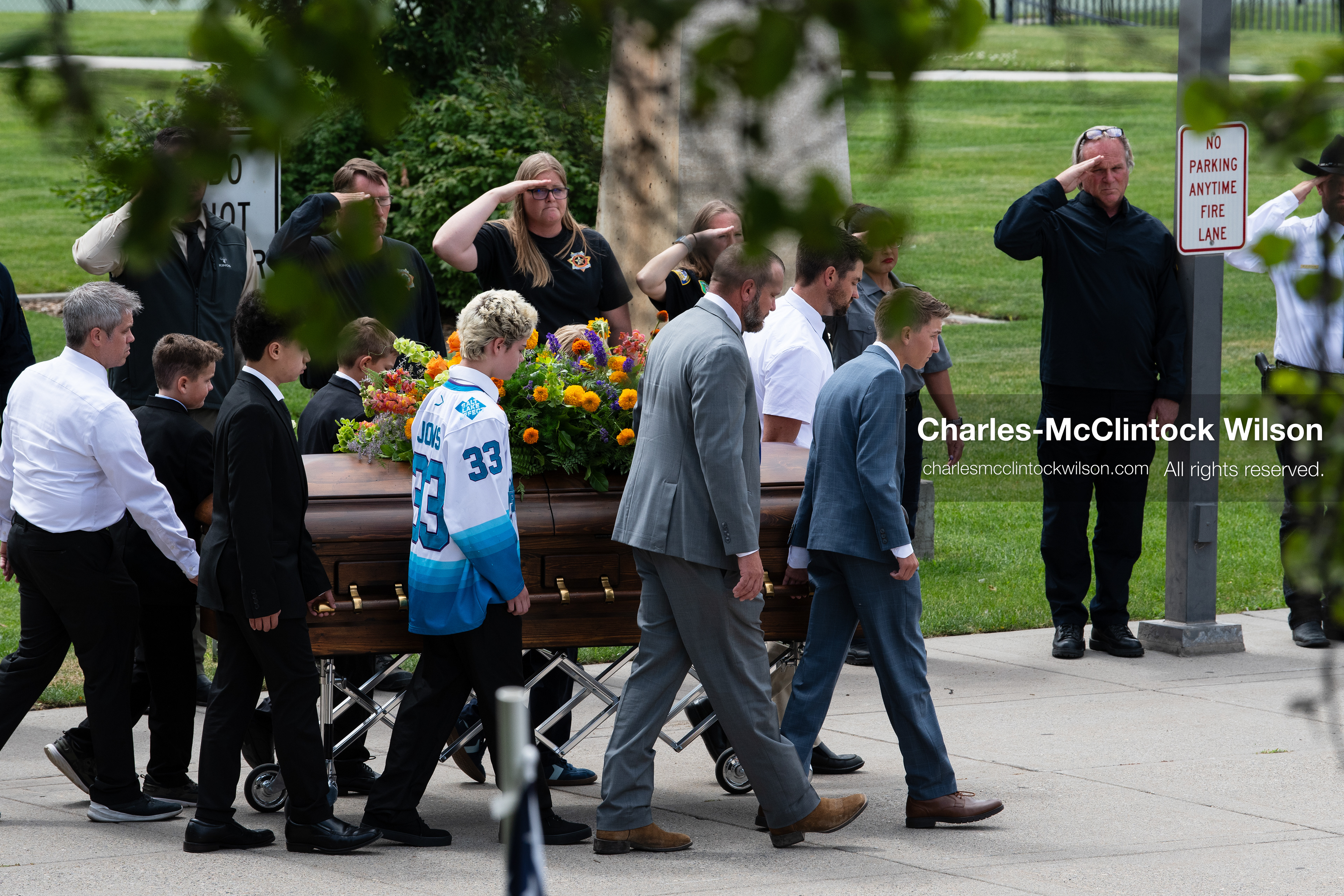 Pallbearers and family members escort the casket of a Long family member outside the UCCU Center at Utah Valley University in Orem, Utah, on Wednesday, July 29, 2026. More than 300 people came to the public memorial ceremony to honor Provo Fire Captain Spencer Long, his wife Katrina, and three of their sons, who died after a flash flood hit their campsite near the Sunglow Campground in Wayne County. (Photo by Charles-McClintock Wilson/Sipa USA)