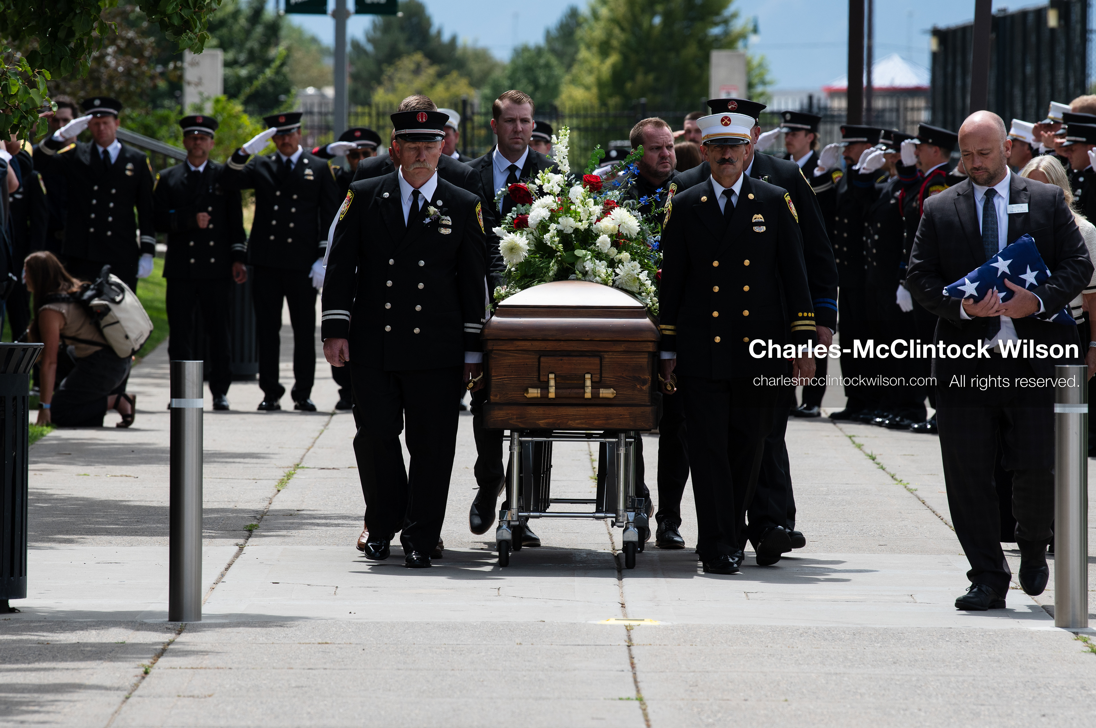 Firefighters and pallbearers escort the casket of Provo Fire Captain Spencer Long outside the UCCU Center on the campus of Utah Valley University in Orem, Utah, on Wednesday, July 29, 2026. More than 300 people came to the public memorial ceremony to honor Captain Long, his wife Katrina, and three of their sons, who died after a flash flood hit their campsite near the Sunglow Campground in Wayne County. (Photo by Charles-McClintock Wilson/Sipa USA)