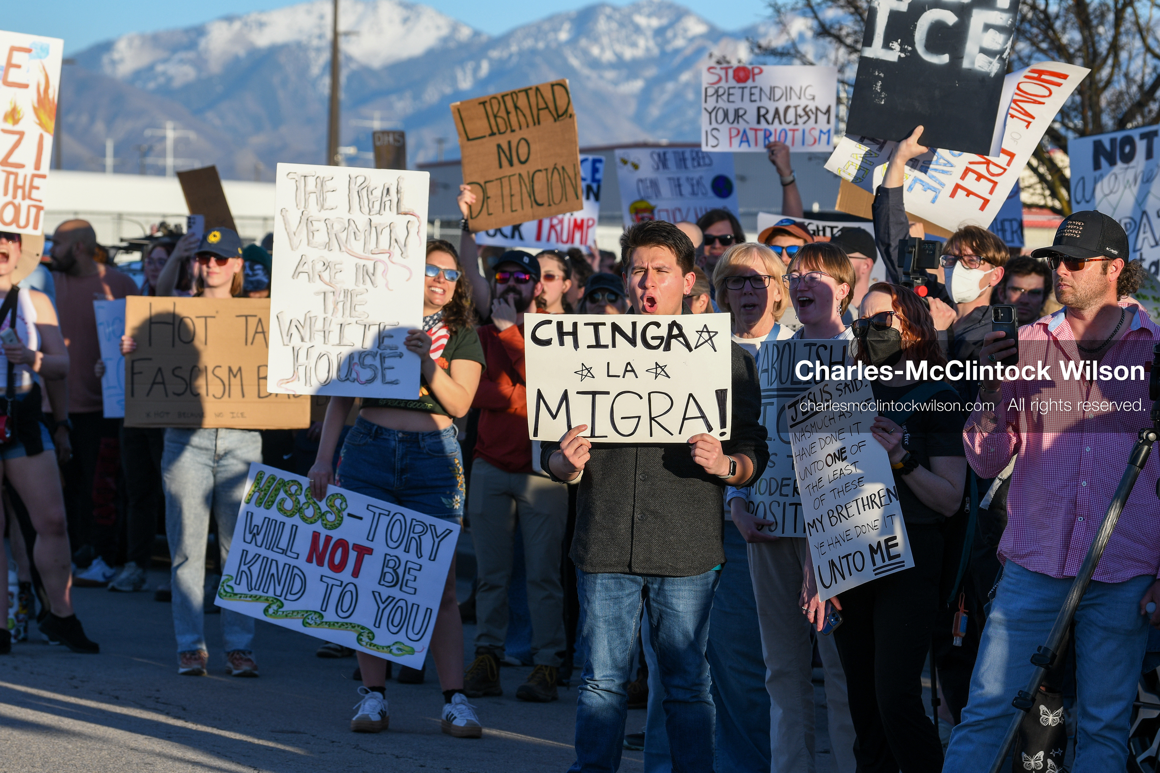 March 18, 2026, Salt Lake City, Utah, USA: People hold signs during a protest at the site of a proposed ICE detention facility on the west side of Salt Lake City. Demonstrators gathered near the warehouse property as part of an ongoing community response to the planned facility. (Credit Image: © Charles McClintock Wilson/ZUMA Press Wire)