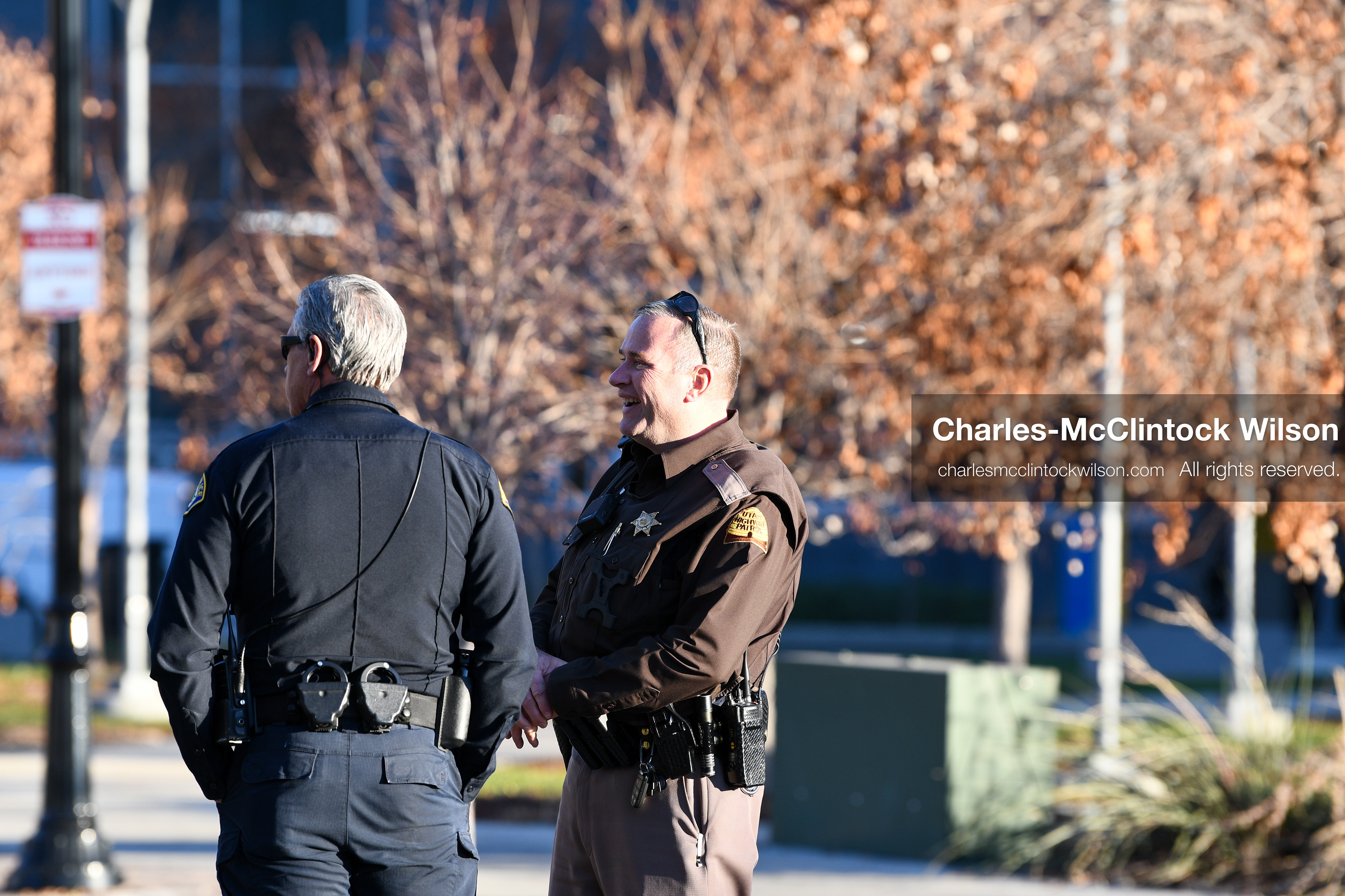 PROVO, UTAH, USA – DECEMBER 11, 2025: A Provo Police officer and a Utah Highway Patrol trooper stand outside the Fourth District Court in Provo during the first in‑person court appearance of Tyler Robinson in the Charlie Kirk murder case. (Credit Image: © Charles‑McClintock Wilson/ZUMA Press Wire)
