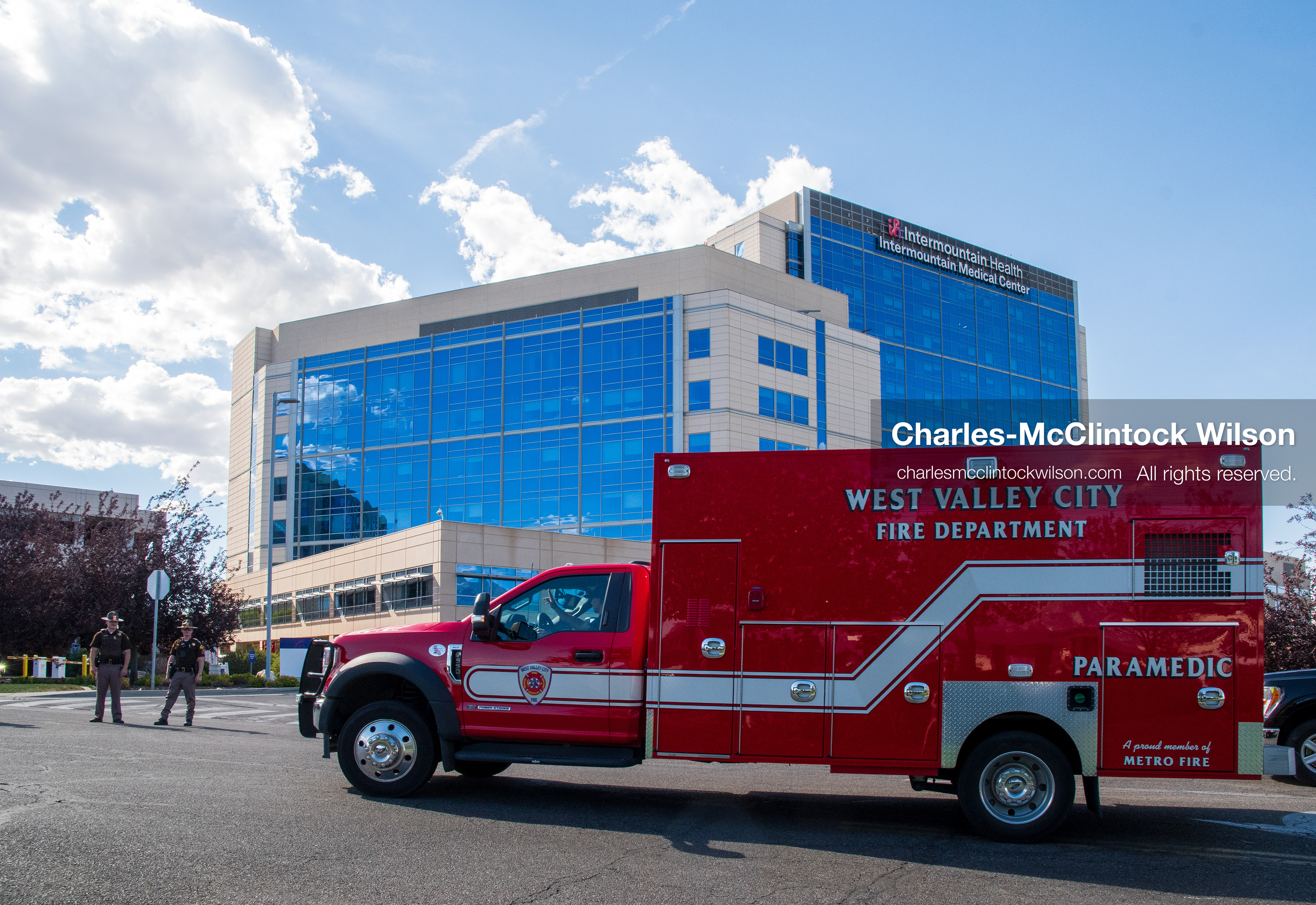 A West Valley City Fire Department paramedic truck sits parked near the facility entrance outside Intermountain Medical Center in Murray, Utah, on Monday, August 17, 2026. Multiple regional law enforcement agencies converged to heavily secure the hospital perimeter as a safety precaution after shooting victims arrived from a fatal shootout that erupted outside a funeral service in nearby Kearns earlier that day. (Photo by Charles-McClintock Wilson/Sipa USA)
