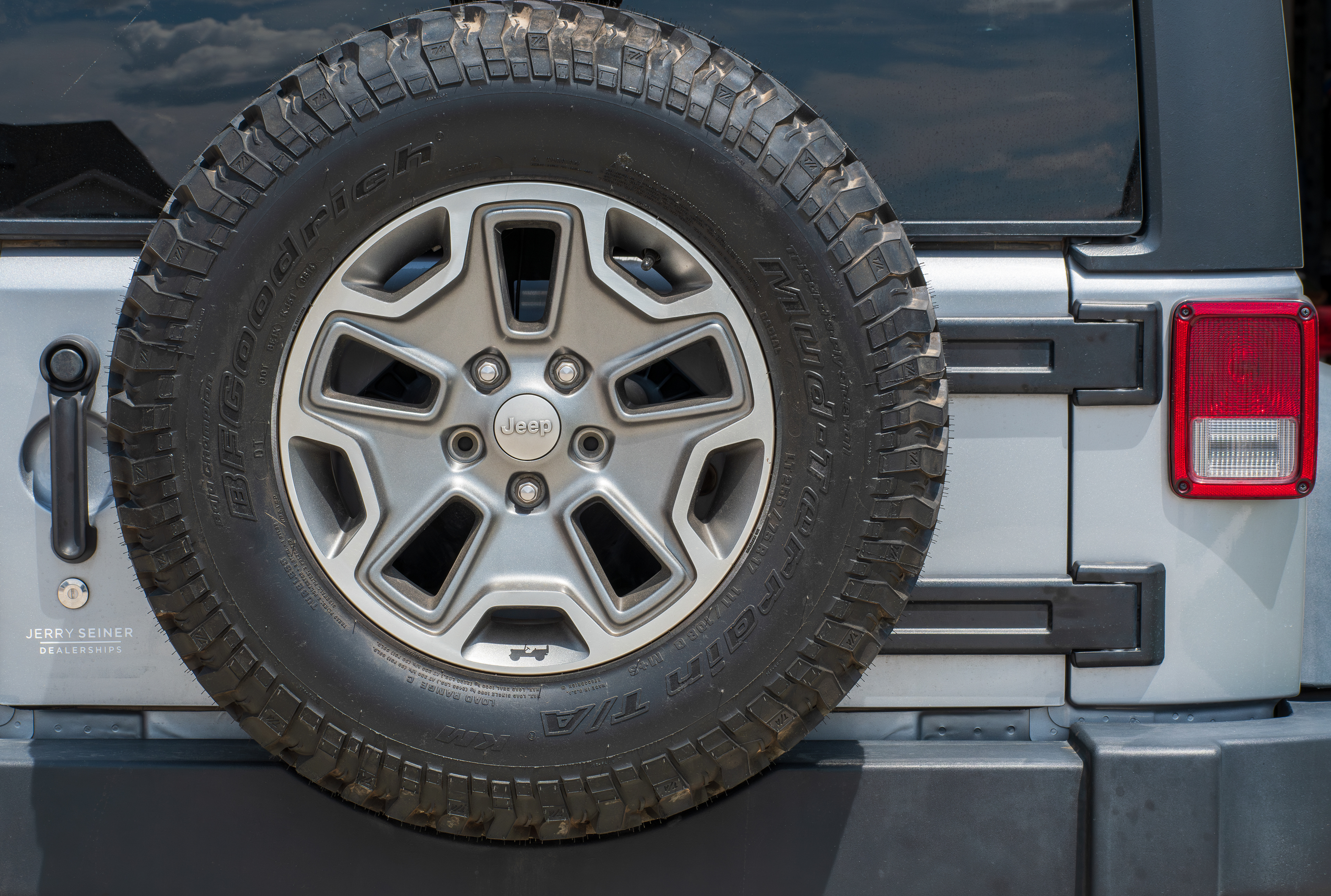 SPRINGVILLE, UT – JUNE 8, 2025: Rear view of a Jeep Wrangler Unlimited with a mounted spare tire is seen parked in Springville, Utah, on June 8, 2025. Jeep is known for its rugged, off-road design.
