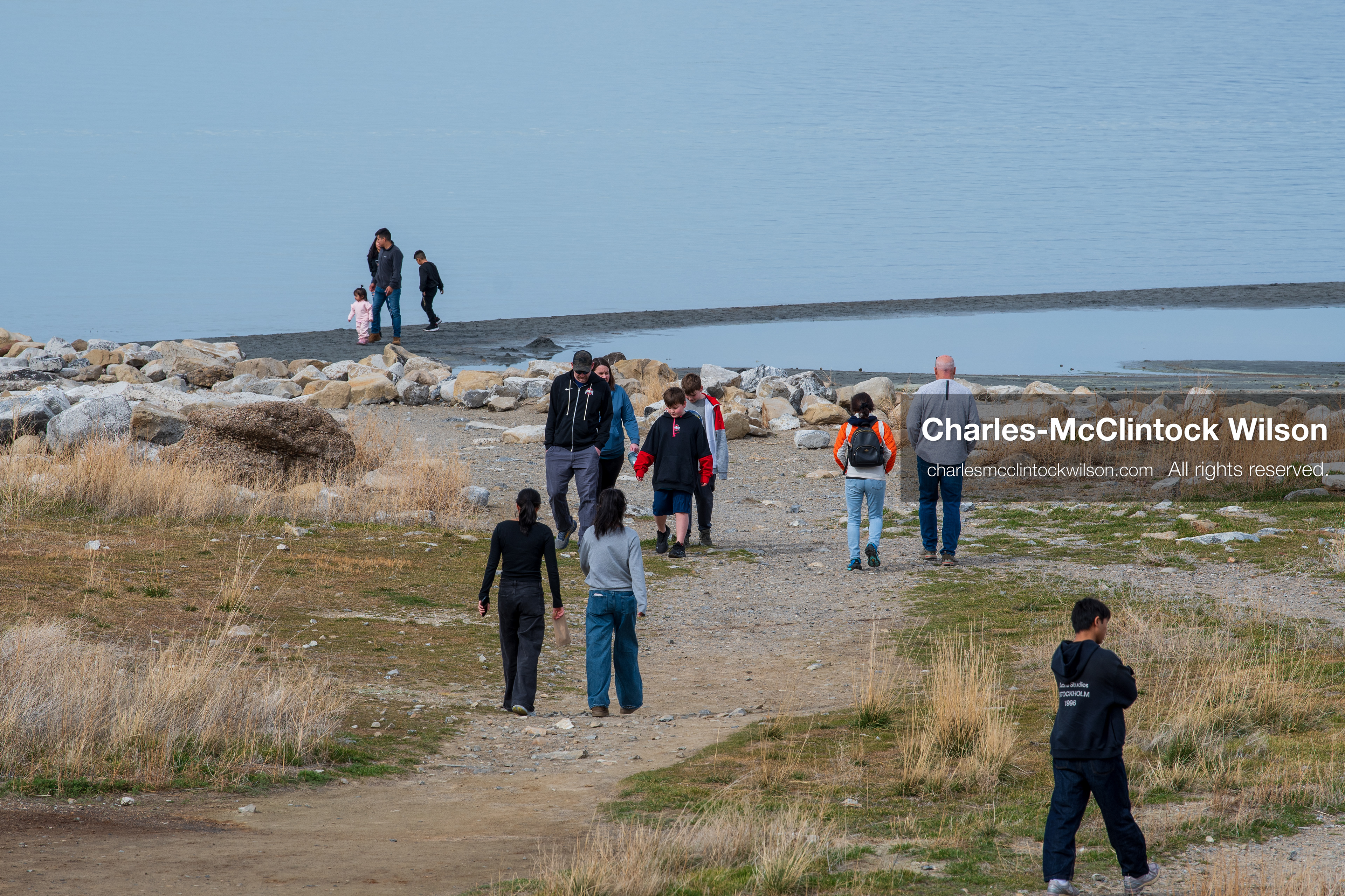 March 1, 2026, Great Salt Lake, Utah, USA: People walk along the shoreline of the Great Salt Lake as water levels remain historically low. Reports from state officials and the Great Salt Lake Strike Team state that the lake continues to fall within a serious adverse‑effects range, with elevations among the lowest recorded in more than one hundred years. The lake has drawn increased public attention as lawmakers consider large‑scale water projects and long‑term plans to address declining conditions. (Credit Image: © Charles‑McClintock Wilson/ZUMA Press Wire)