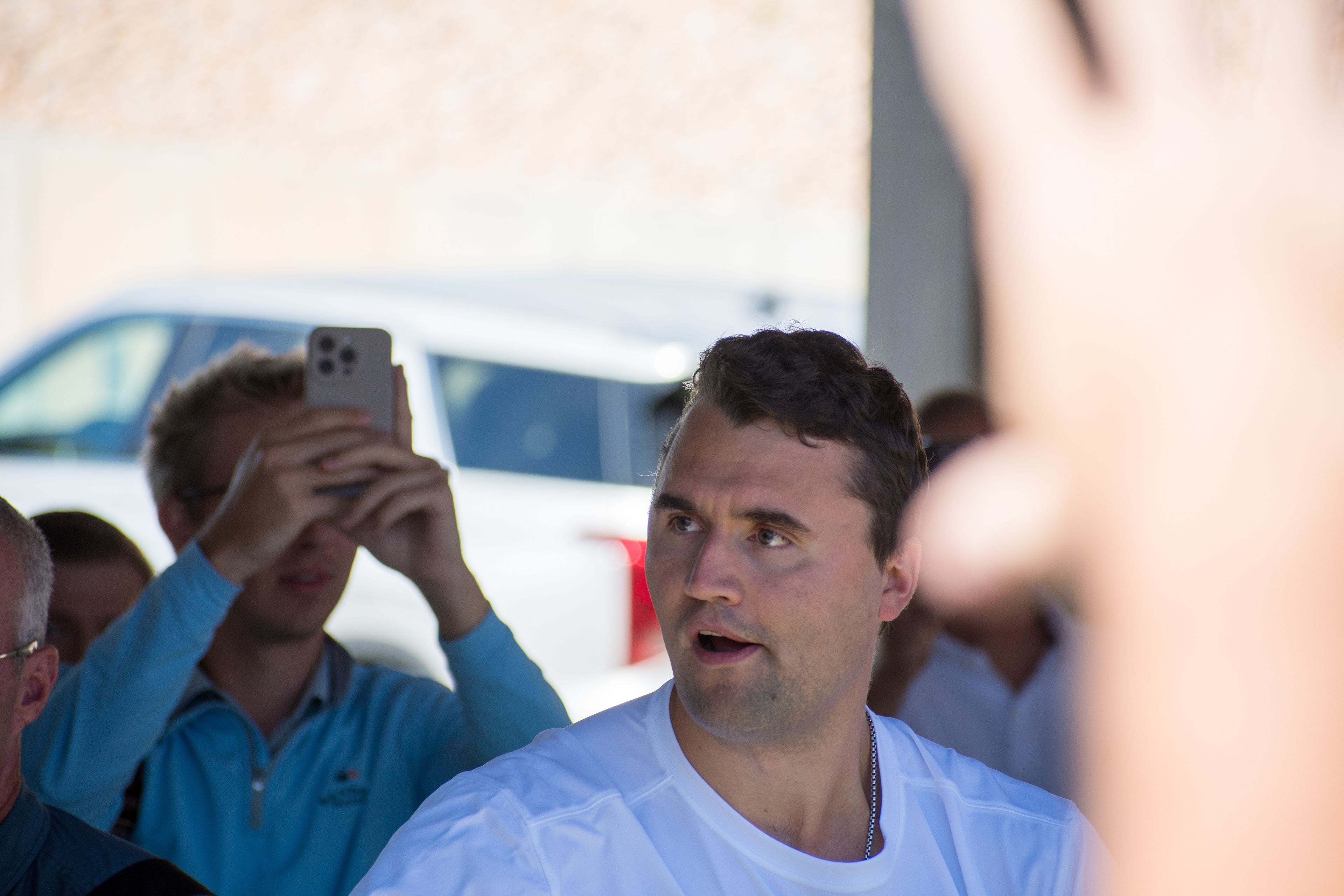 OREM, UTAH – SEPTEMBER 10, 2025: Charlie Kirk arrives at Utah Valley University for a scheduled public event. Wearing a shirt emblazoned with the word “FREEDOM,” Kirk walks among supporters and staff in a moment of visible anticipation. The image marks the beginning of his final public appearance, capturing the atmosphere of civic energy and symbolic presence that defined the day. © Charles-McClintock Wilson / ZUMA Press
