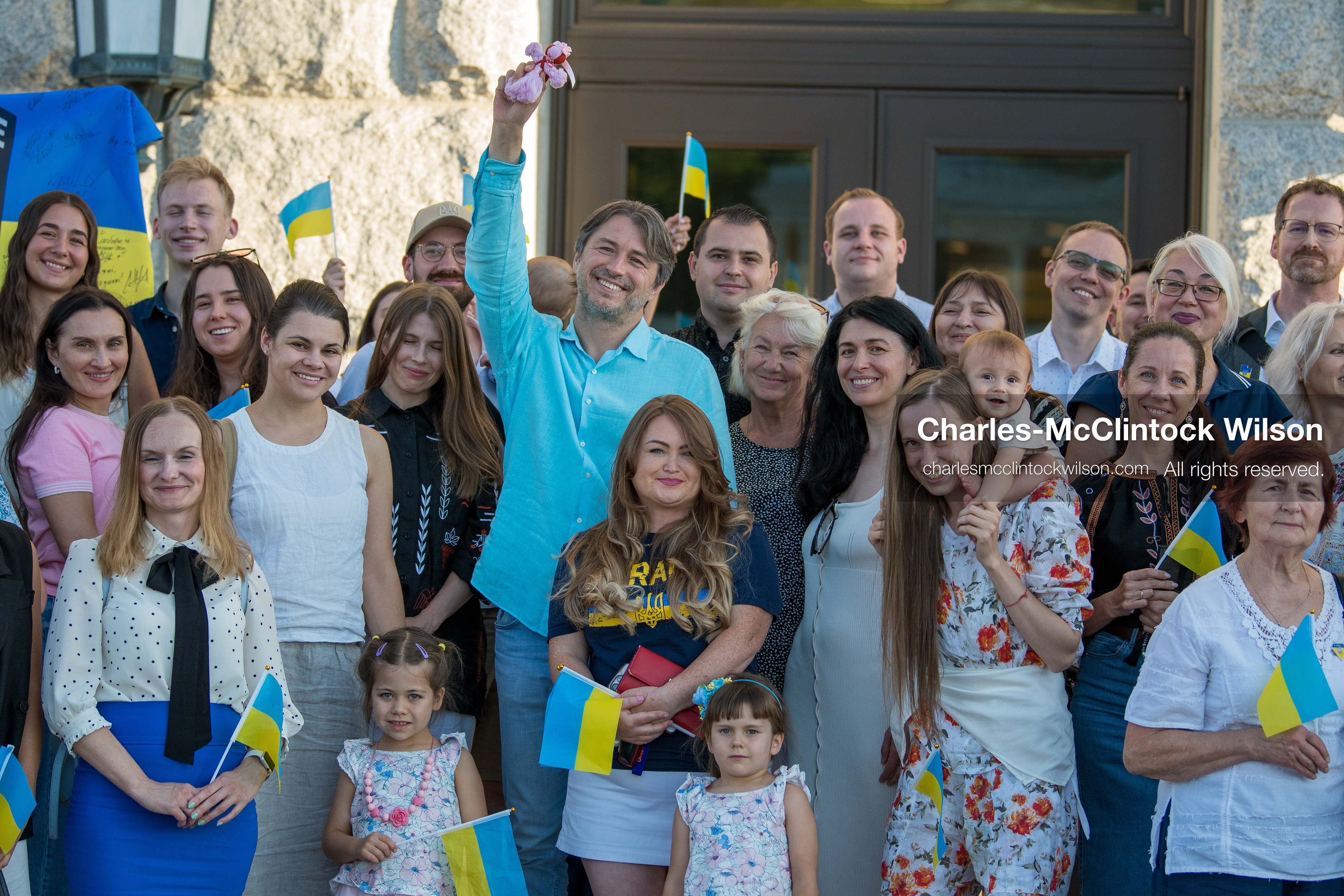 July 23, 2026, Salt Lake City, Utah, USA: Ukrainian activist SERHIY PRYTULA holds a small doll while posing for a group photograph with supporters during a community meeting at the Utah State Capitol building in Salt Lake City, Utah, on Thursday, July 23, 2026. The event, titled ''Ukraine in the Fifth Year of the Full-Scale War: An Honest Conversation,'' was hosted by the Prytula Foundation USA to discuss civil defense and ongoing humanitarian aid initiatives. (Credit Image: © Charles-McClintock Wilson/ZUMA Press Wire)