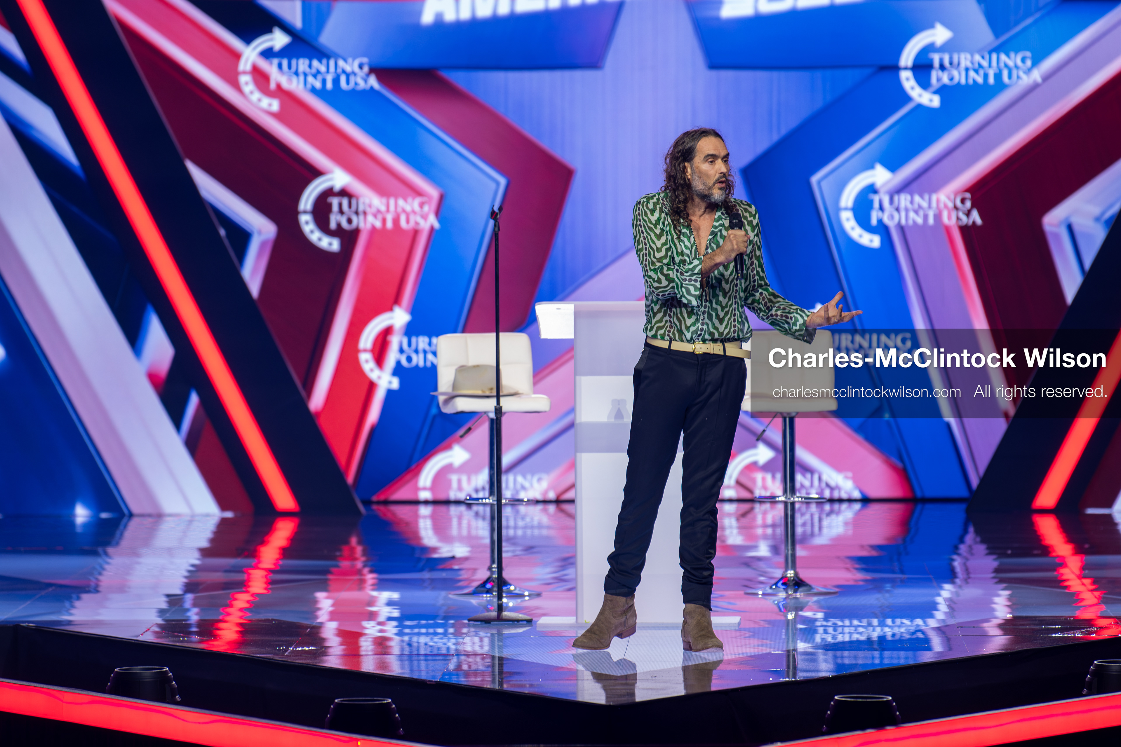 December 18, 2025, Phoenix, Arizona, USA: Russell Brand speaks during Day One of Turning Point USA’s AmericaFest 2025 at the Phoenix Convention Center in Phoenix, Arizona.   (Credit Image: © Charles‑McClintock Wilson/ZUMA Press Wire)