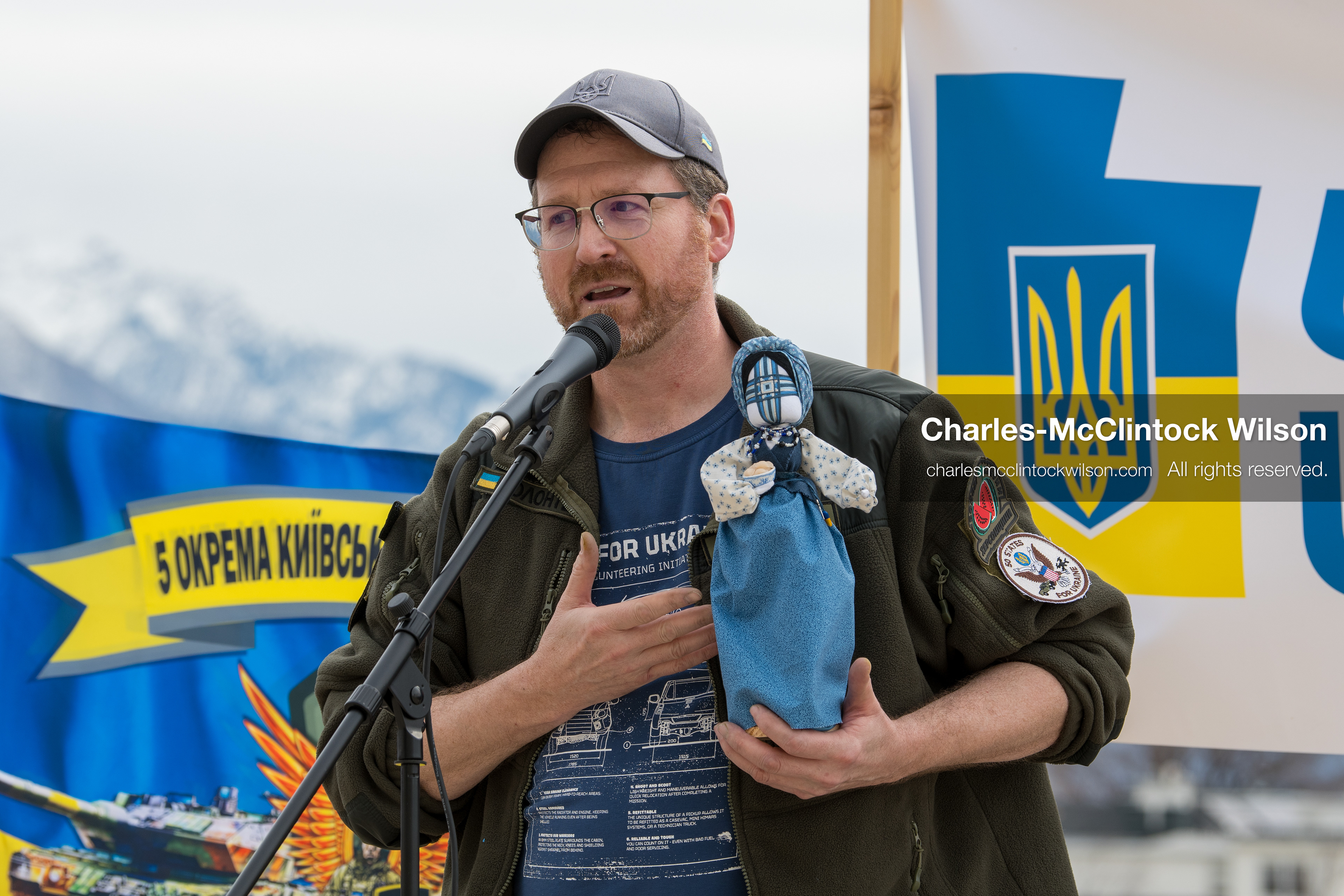 February 28, 2026, Salt Lake City, Utah, USA: NATHANIEL SANDERS, a Salt Lake County Deputy District Attorney and a vocal advocate for Ukraine, speaks while holding a traditional Ukrainian motanka doll, a handmade protective symbol, during the Stand With Ukraine rally at the Utah State Capitol. The event marked the four year anniversary of the full scale Russian invasion of Ukraine and brought community members together in support of Ukrainians and local humanitarian efforts. (Credit Image: © Charles McClintock Wilson/ZUMA Press Wire)