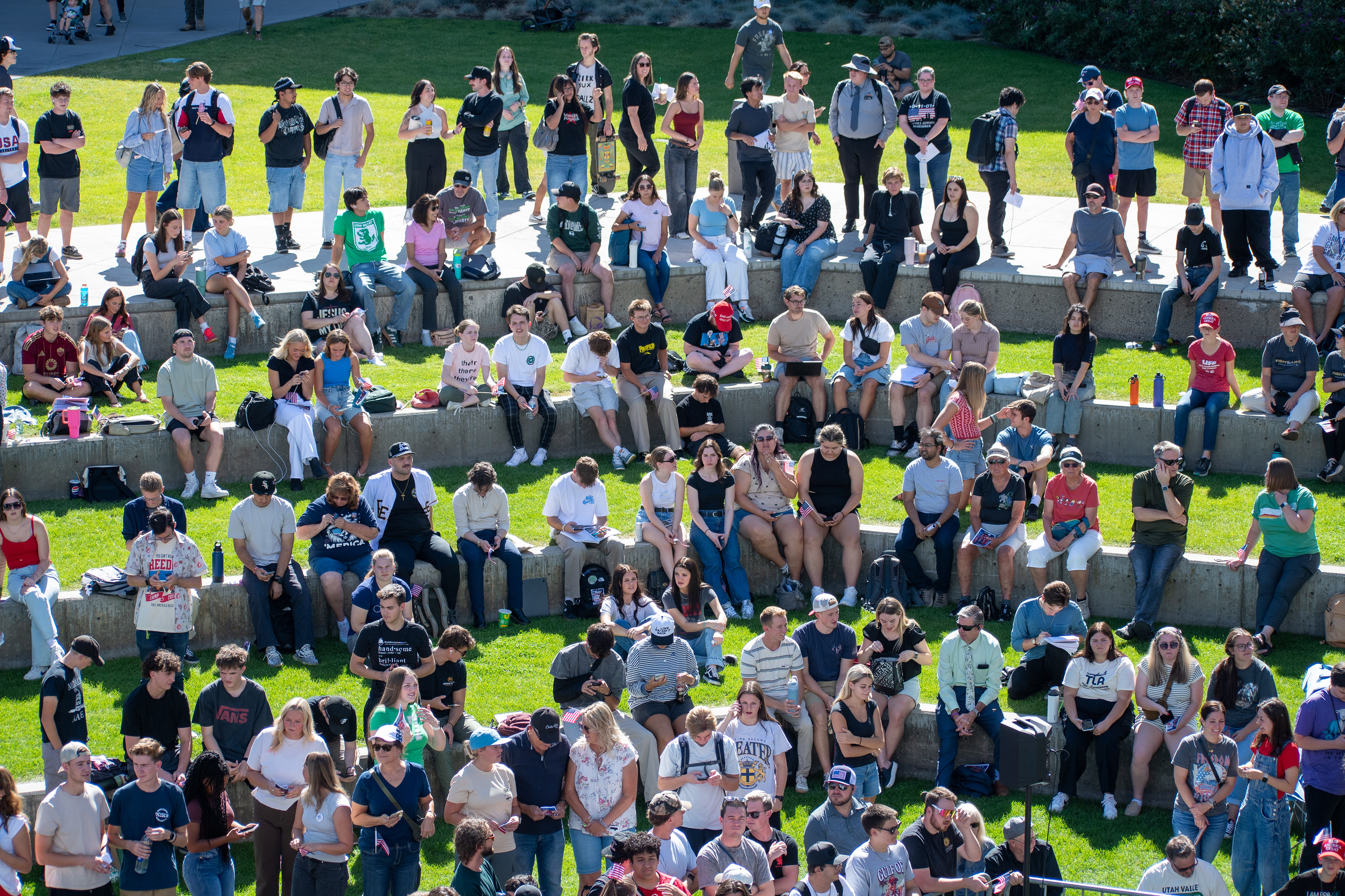 OREM, UTAH – SEPTEMBER 10, 2025: Attendees gather across the lawn and walkways at Utah Valley University during the opening stop of the American Comeback Tour. Seated and standing in casual formation, the crowd reflects a moment of civic presence, curiosity, and communal engagement. The image captures the spatial texture and emotional tone of a public event designed to connect, energize, and engage. © Charles-McClintock Wilson / ZUMA Press