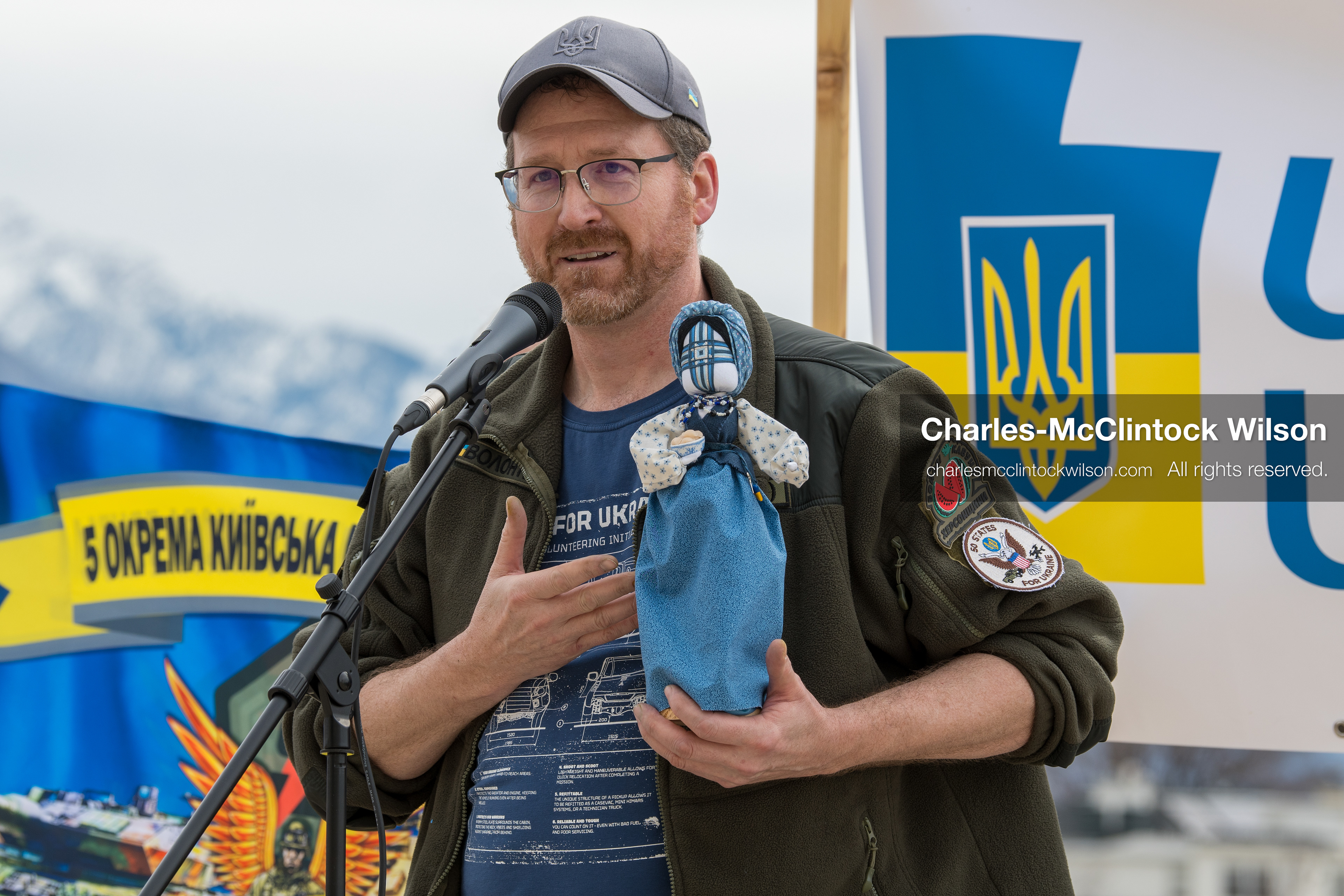 February 28, 2026, Salt Lake City, Utah, USA: NATHANIEL SANDERS, a Salt Lake County Deputy District Attorney and a vocal advocate for Ukraine, speaks while holding a traditional Ukrainian motanka doll, a handmade protective symbol, during the Stand With Ukraine rally at the Utah State Capitol. The event marked the four year anniversary of the full scale Russian invasion of Ukraine and brought community members together in support of Ukrainians and local humanitarian efforts. (Credit Image: © Charles McClintock Wilson/ZUMA Press Wire)