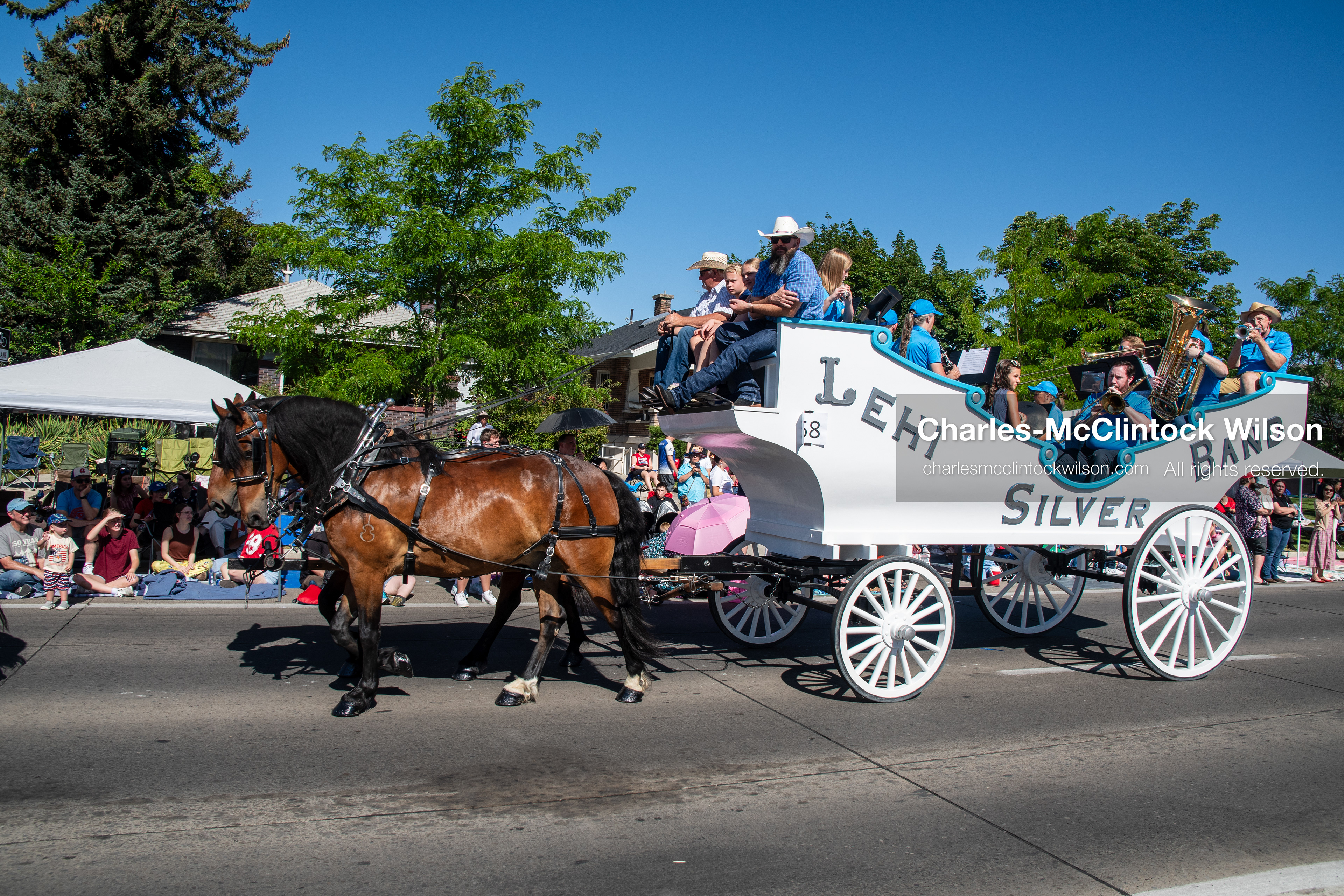 July 4, 2026, Provo, Utah, USA: A horse-drawn wagon carrying members of the Lehi Silver Band rolls down the street during America's Freedom Festival Grand Parade in Provo, Utah, Saturday, July 4, 2026. The annual Independence Day event features expanded programming to honor the 250th anniversary of United States independence. (Credit Image: © Charles-McClintock Wilson/ZUMA Press Wire)