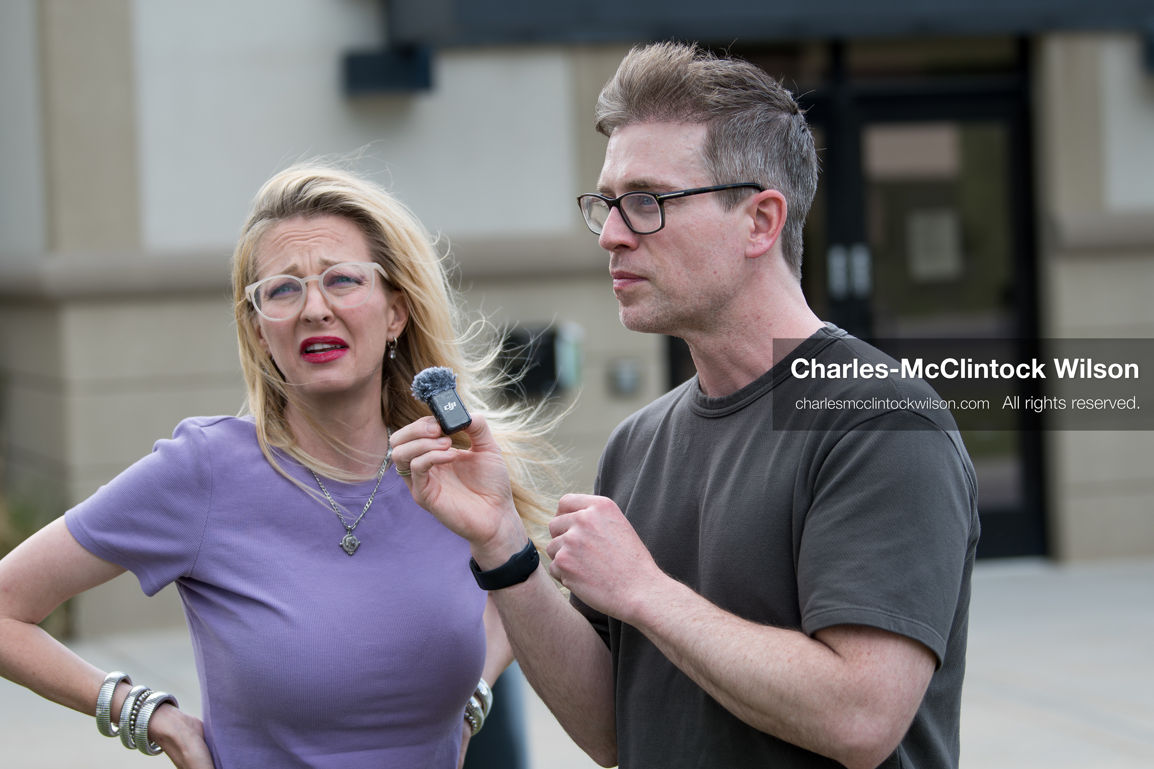 May 13, 2026, Brigham City, Utah, USA: US political satirist and digital creator WALTER MASTERSON interviews a woman outside the Box Elder County Justice Courthouse in Brigham City, Utah, during a gathering over the proposed data‑center project backed by businessman Kevin O’Leary, which has drawn public concern over water use, power demand, and transparency. (Credit Image: © Charles‑McClintock Wilson/ZUMA Press Wire)