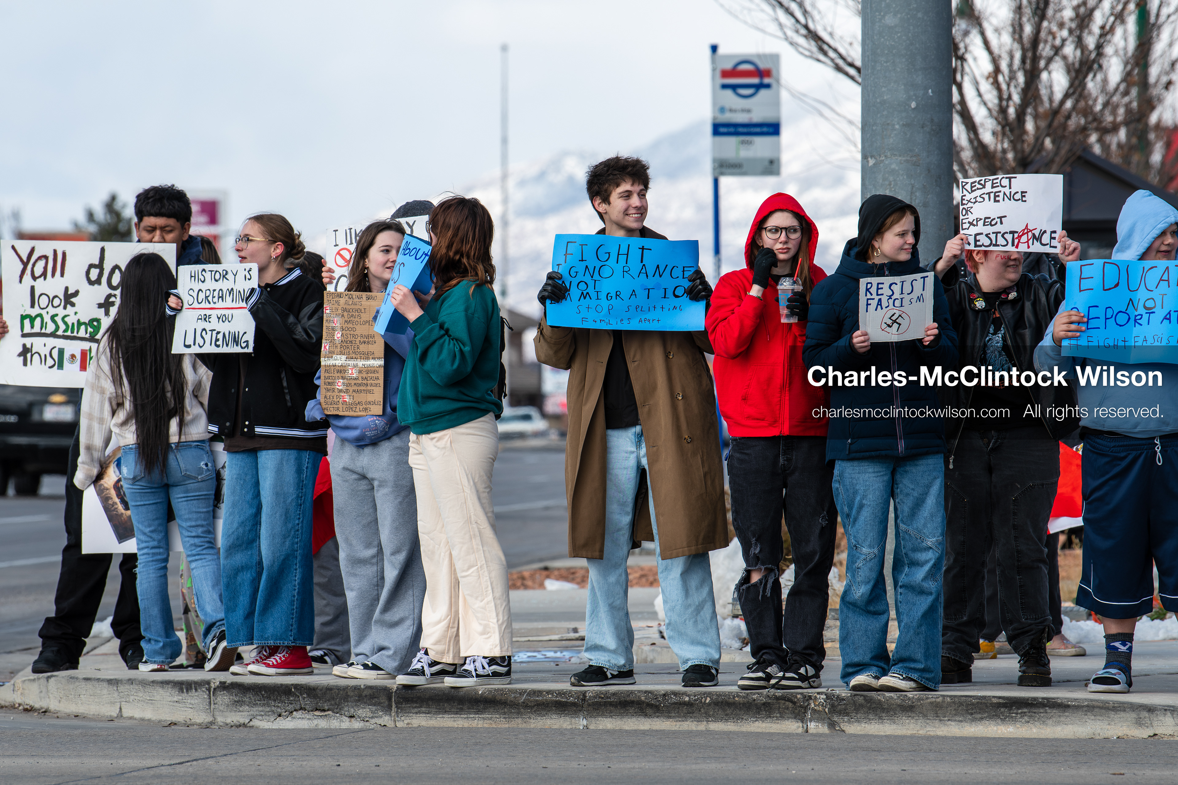 February 20, 2026, Orem, Utah, USA: High school students gather along State Street in front of Orem City Hall during a student led protest against ICE and federal immigration enforcement. Demonstrators hold signs as they stand near the roadway while traffic continues through the area. (Credit Image: © Charles McClintock Wilson/ZUMA Press Wire)