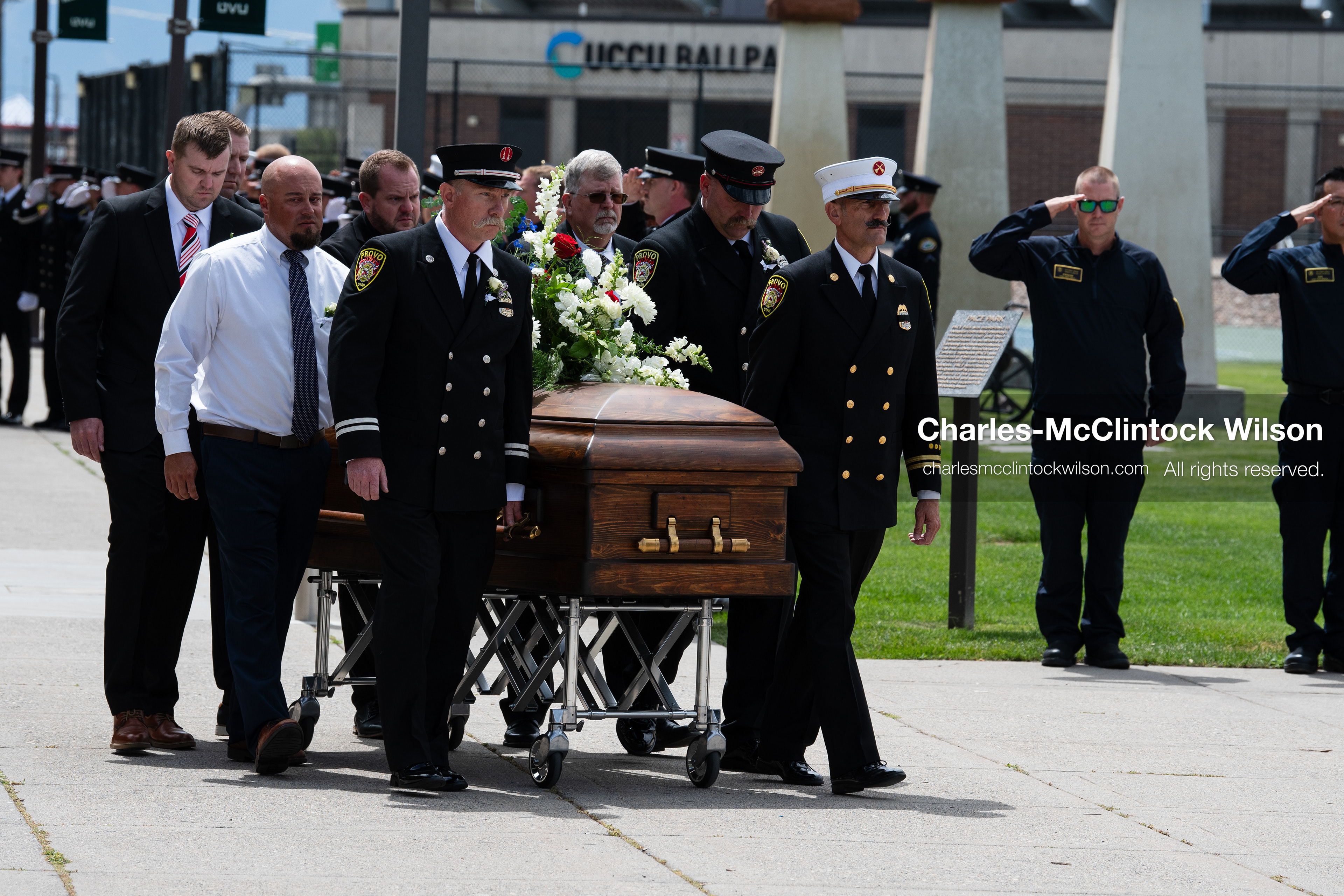 Firefighters and pallbearers escort the casket of Provo Fire Captain Spencer Long outside the UCCU Center on the campus of Utah Valley University in Orem, Utah, on Wednesday, July 29, 2026. More than 300 people came to the public memorial ceremony to honor Captain Long, his wife Katrina, and three of their sons, who died after a flash flood hit their campsite near the Sunglow Campground in Wayne County. (Photo by Charles-McClintock Wilson/Sipa USA)