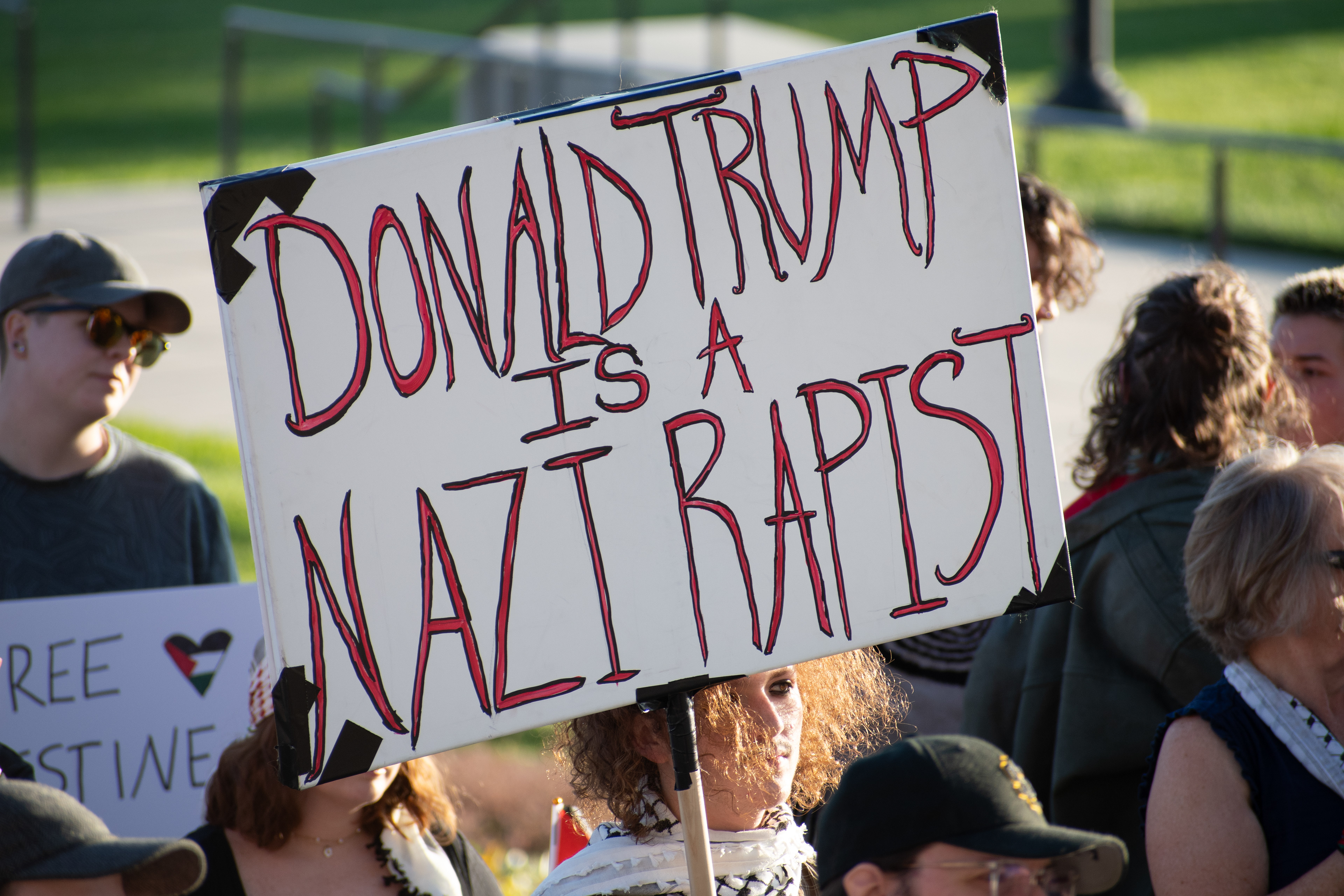 October 10, 2025, Salt Lake City, Utah, USA: Protesters gather during the Free Palestine Rally organized in front of the Utah State Capitol. One participant holds a sign with a political message critical of President Donald Trump. (Credit Image: © Charles-McClintock Wilson/ZUMA Press Wire)